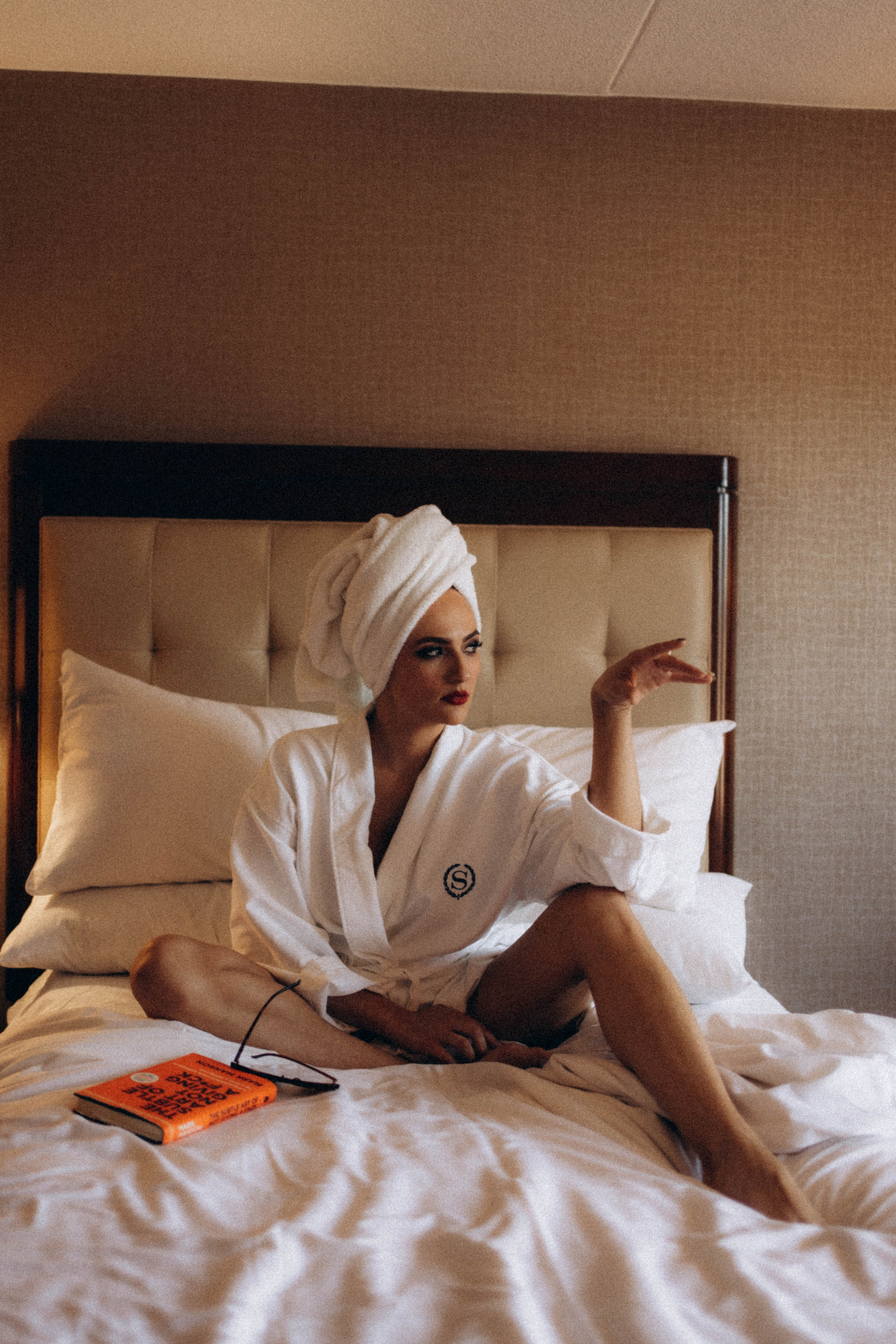 Bride standing near Troy’s Victorian architecture.