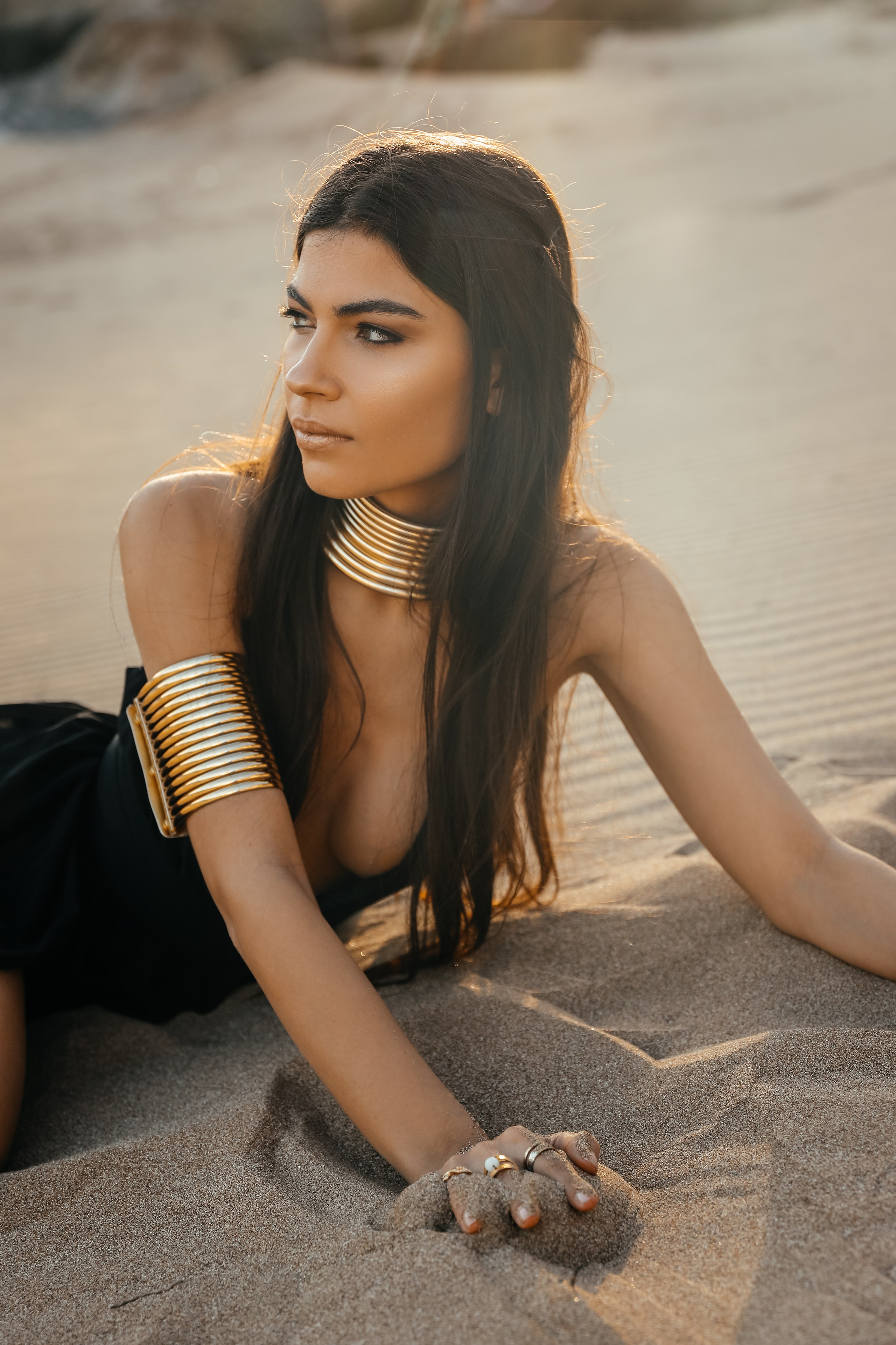 "Silhouette of Solitude: A Black-Clad Beauty in the Desert"