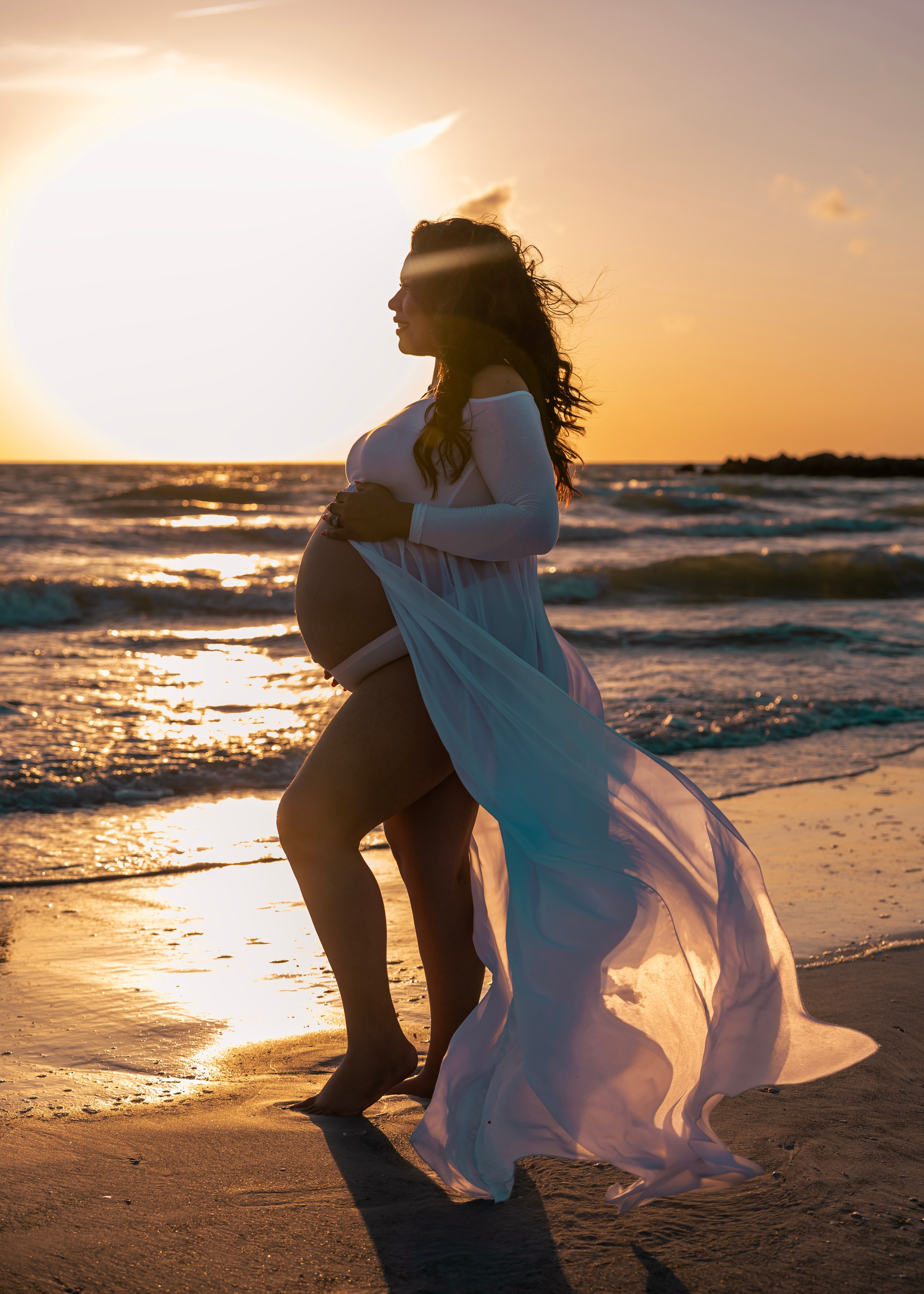 maternity photo on the sunset at the beach