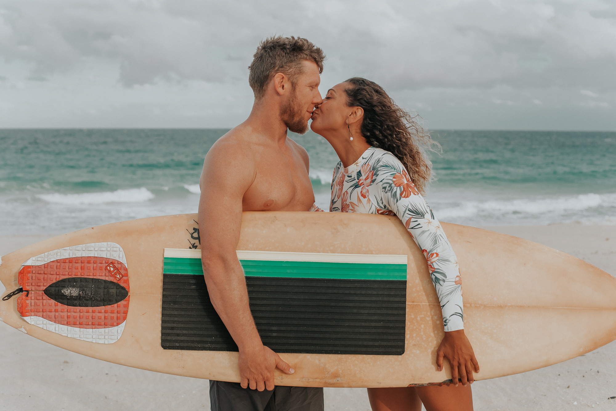 Engagement photo session with surf board. My name is Kate and I am family and wedding photographer