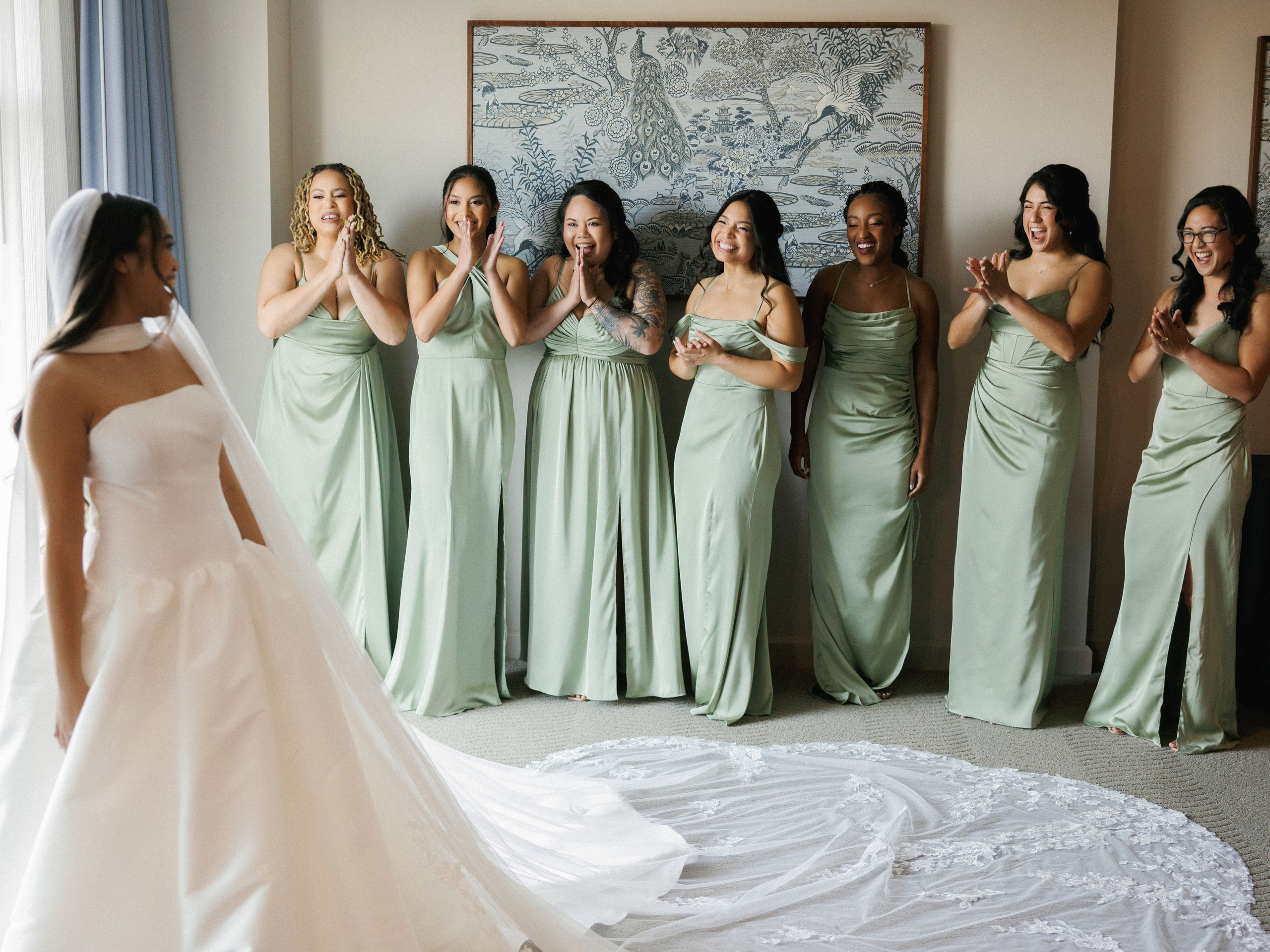Bride with bridesmaids in sage green dresses
