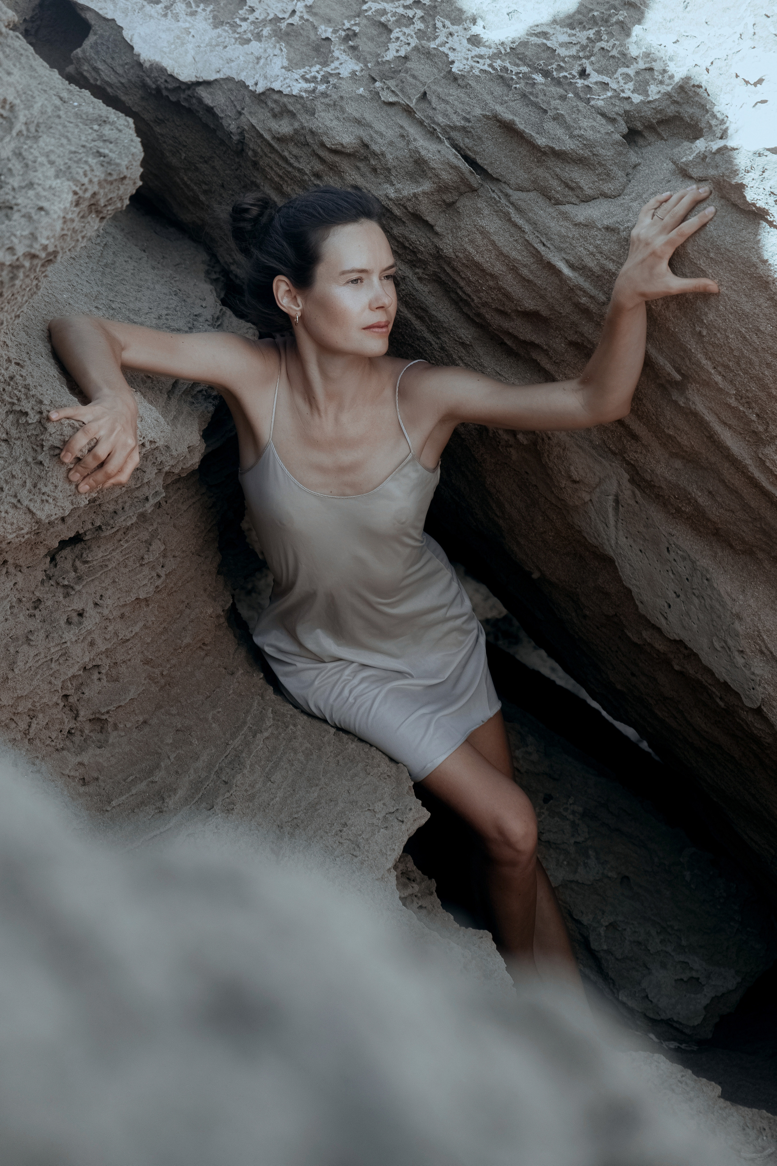 Conceptual photo session on a rocky beach