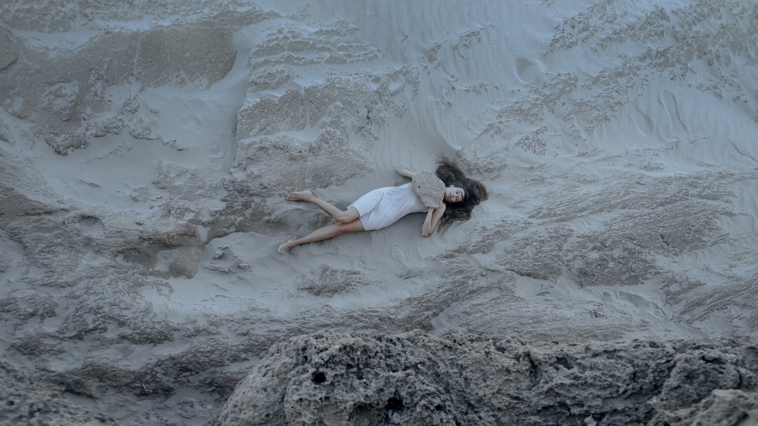Conceptual photo session on a rocky beach