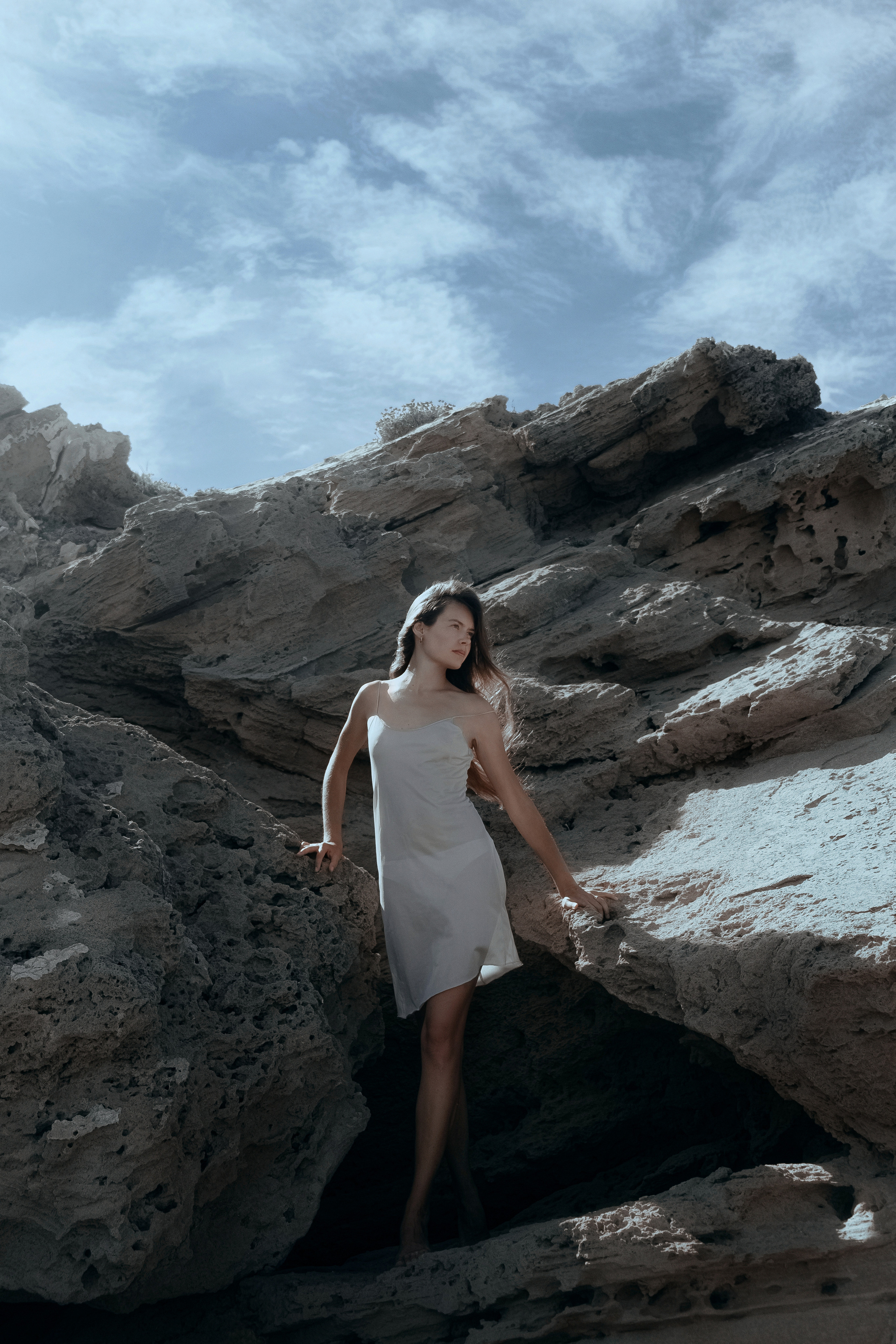 Conceptual photo session on a rocky beach