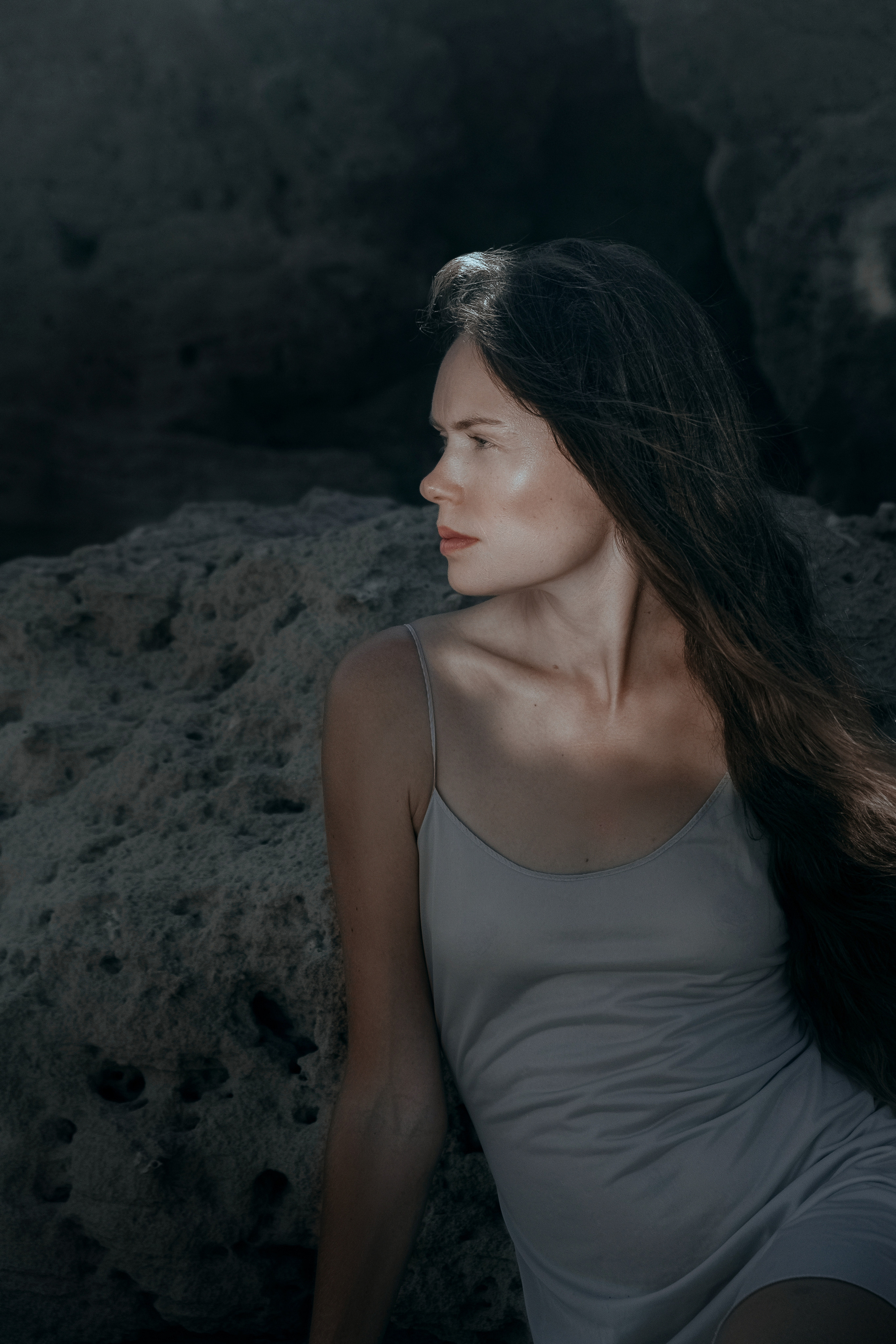 Conceptual photo session on a rocky beach