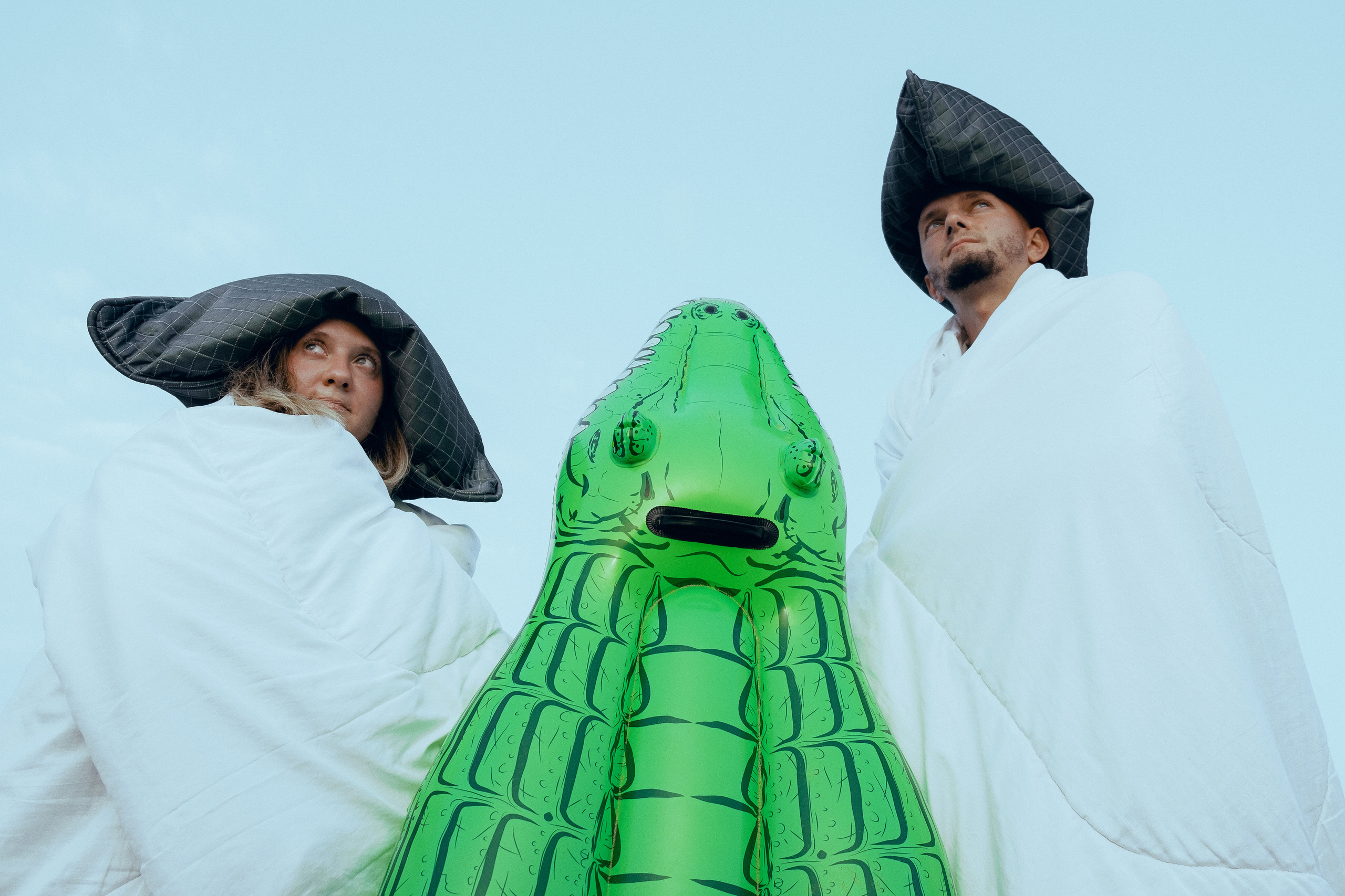 Crazy love story on the beach with an inflatable crocodile
