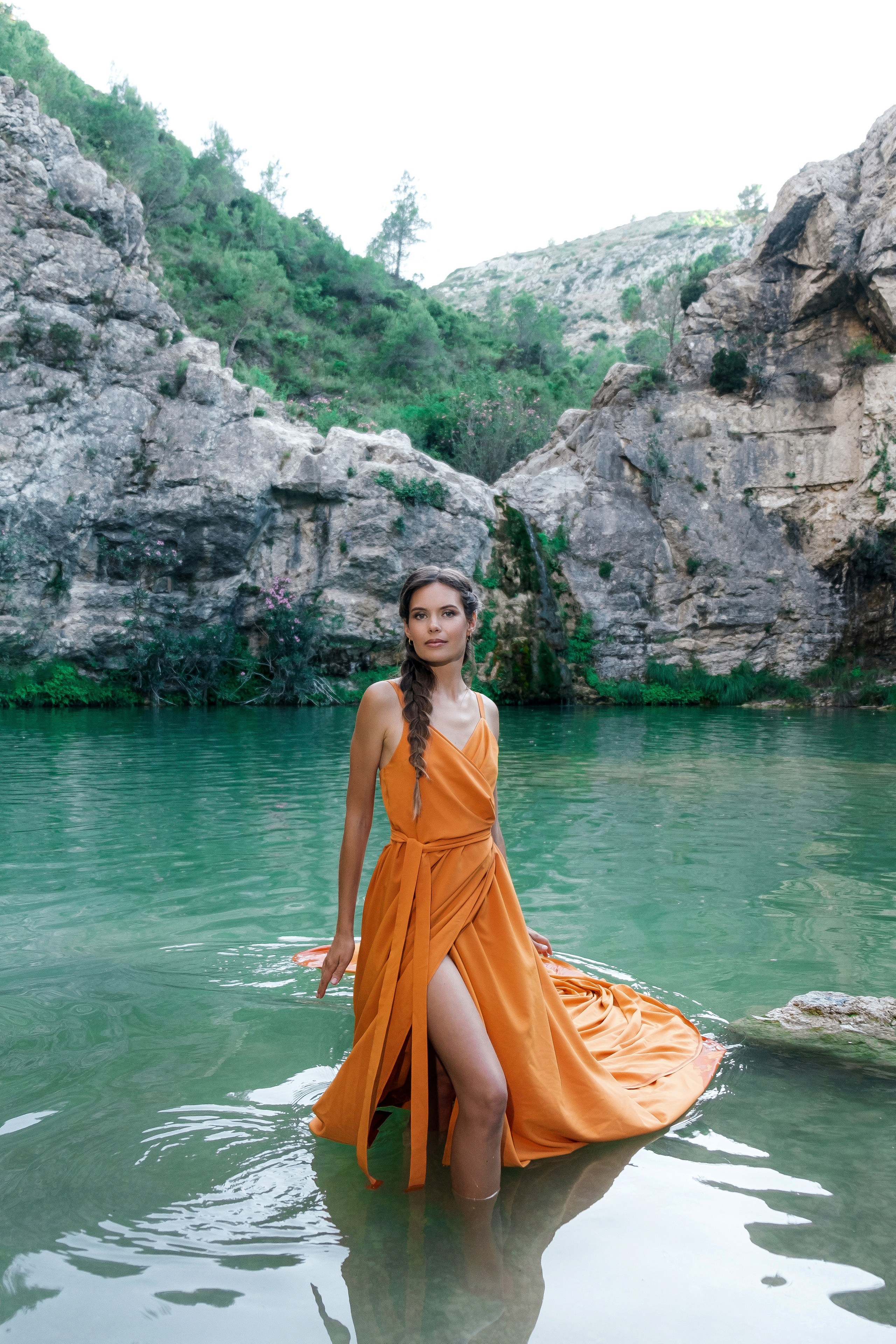 Photoshoot in evening colored dresses by the waterfall