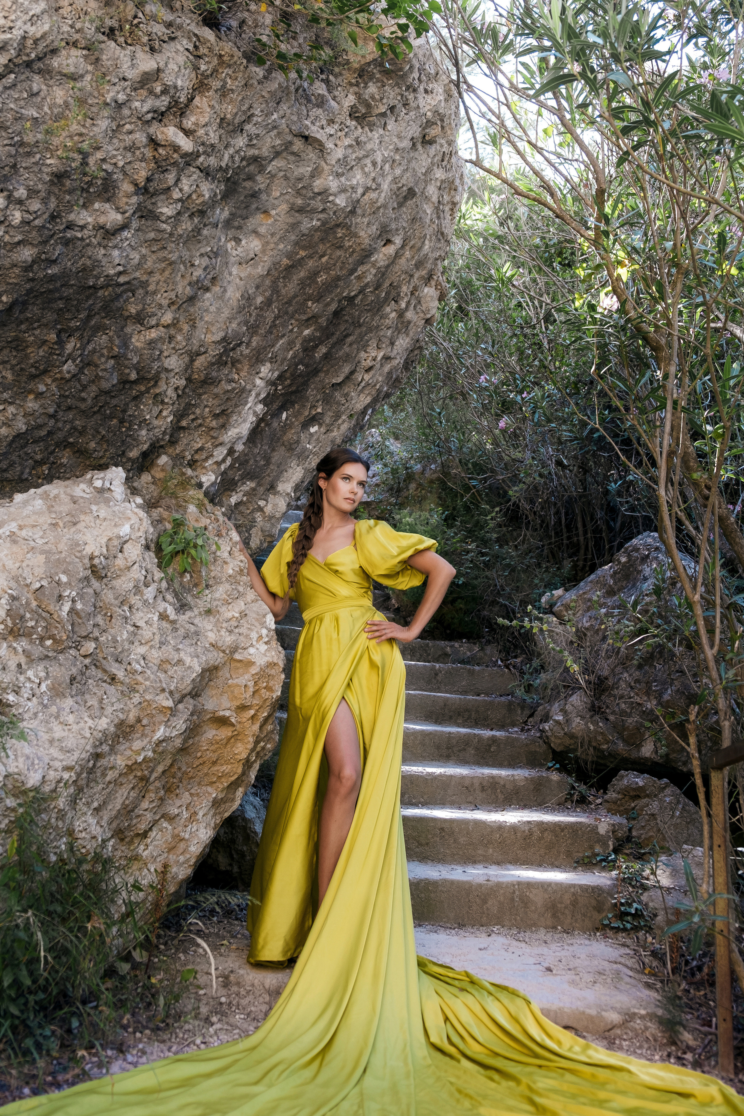 Photoshoot in evening colored dresses by the waterfall