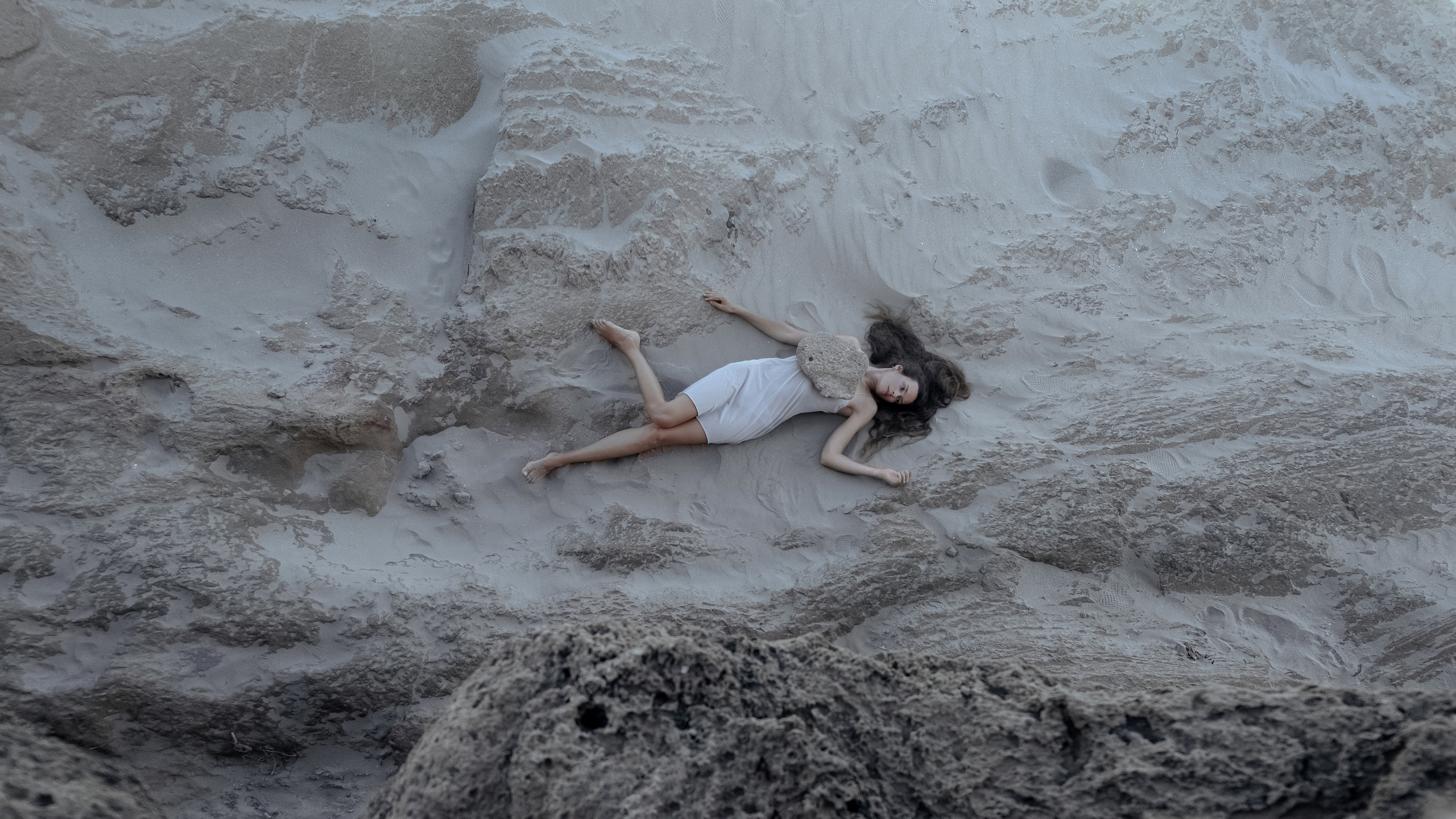 Conceptual photo session on a rocky beach