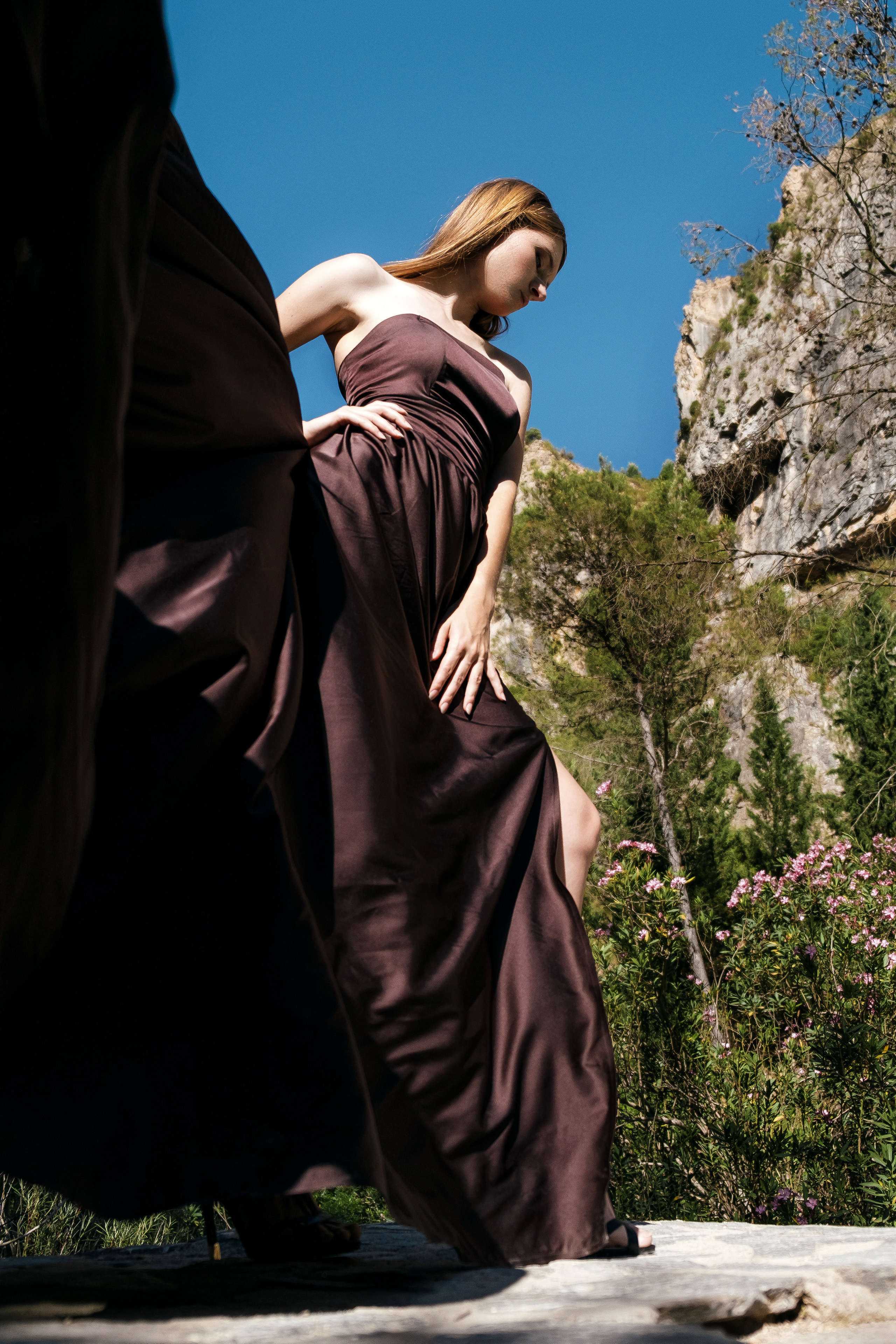 Photoshoot in evening colored dresses by the waterfall