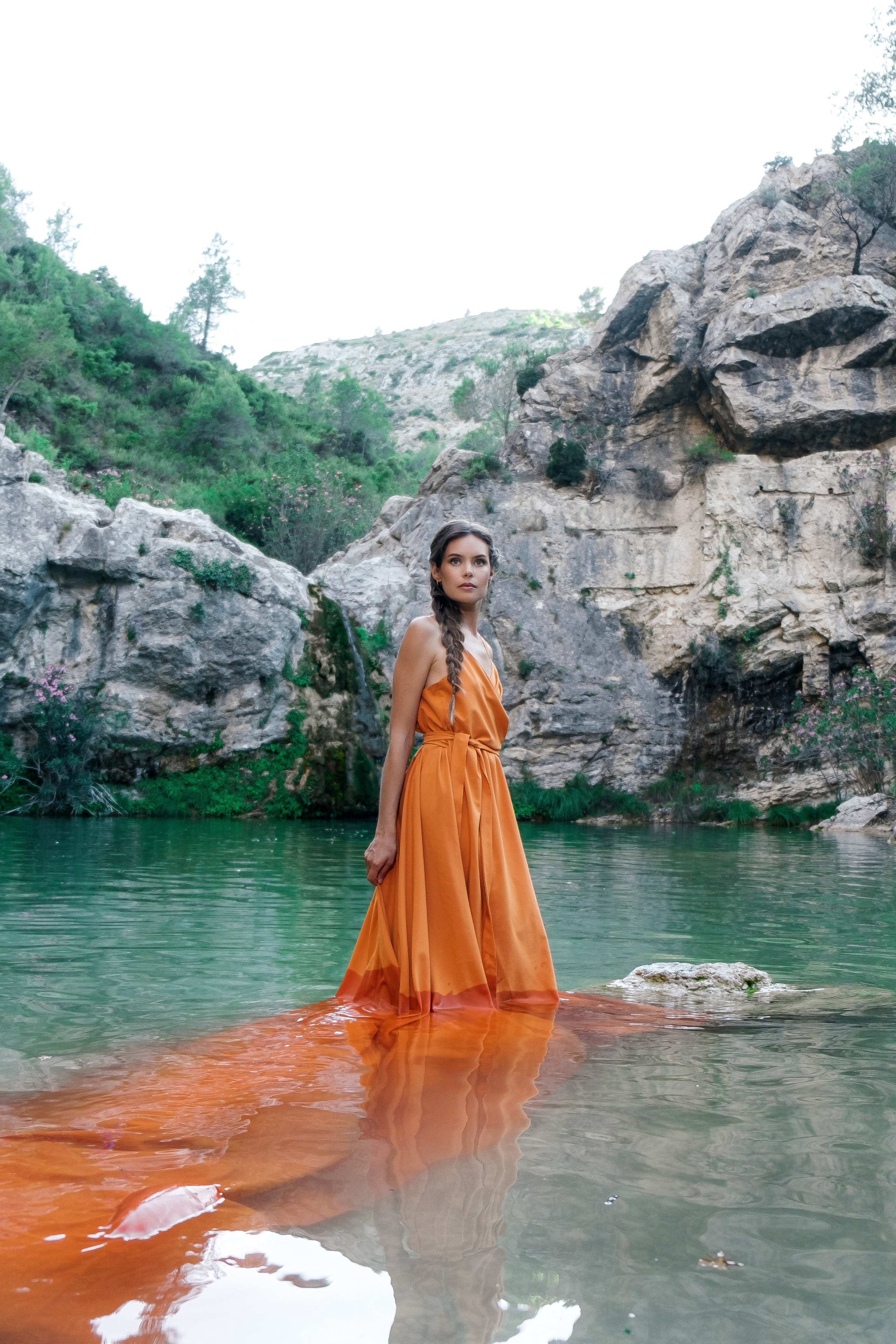 Photoshoot in evening colored dresses by the waterfall