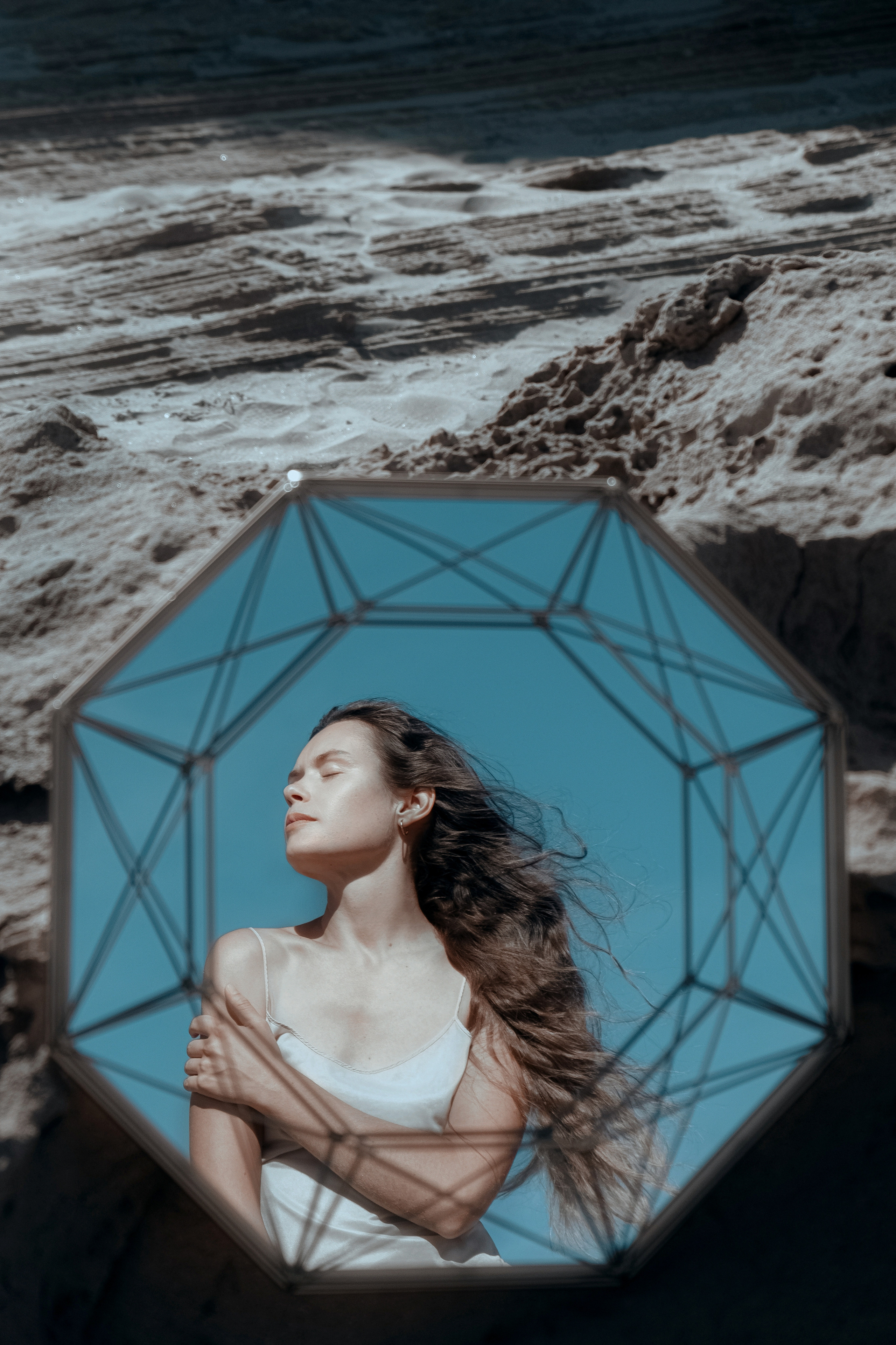 Conceptual photo session on a rocky beach