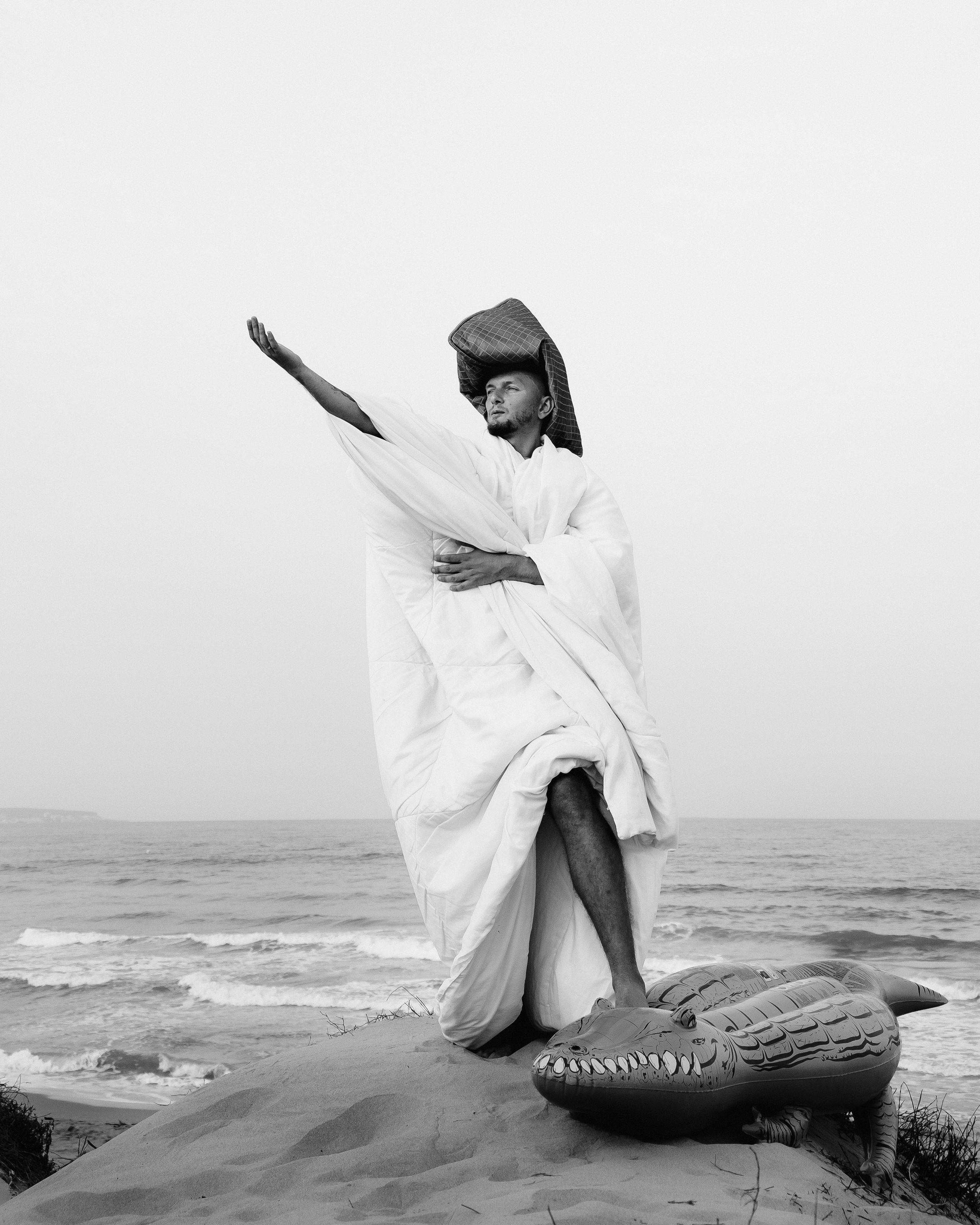 Crazy love story on the beach with an inflatable crocodile