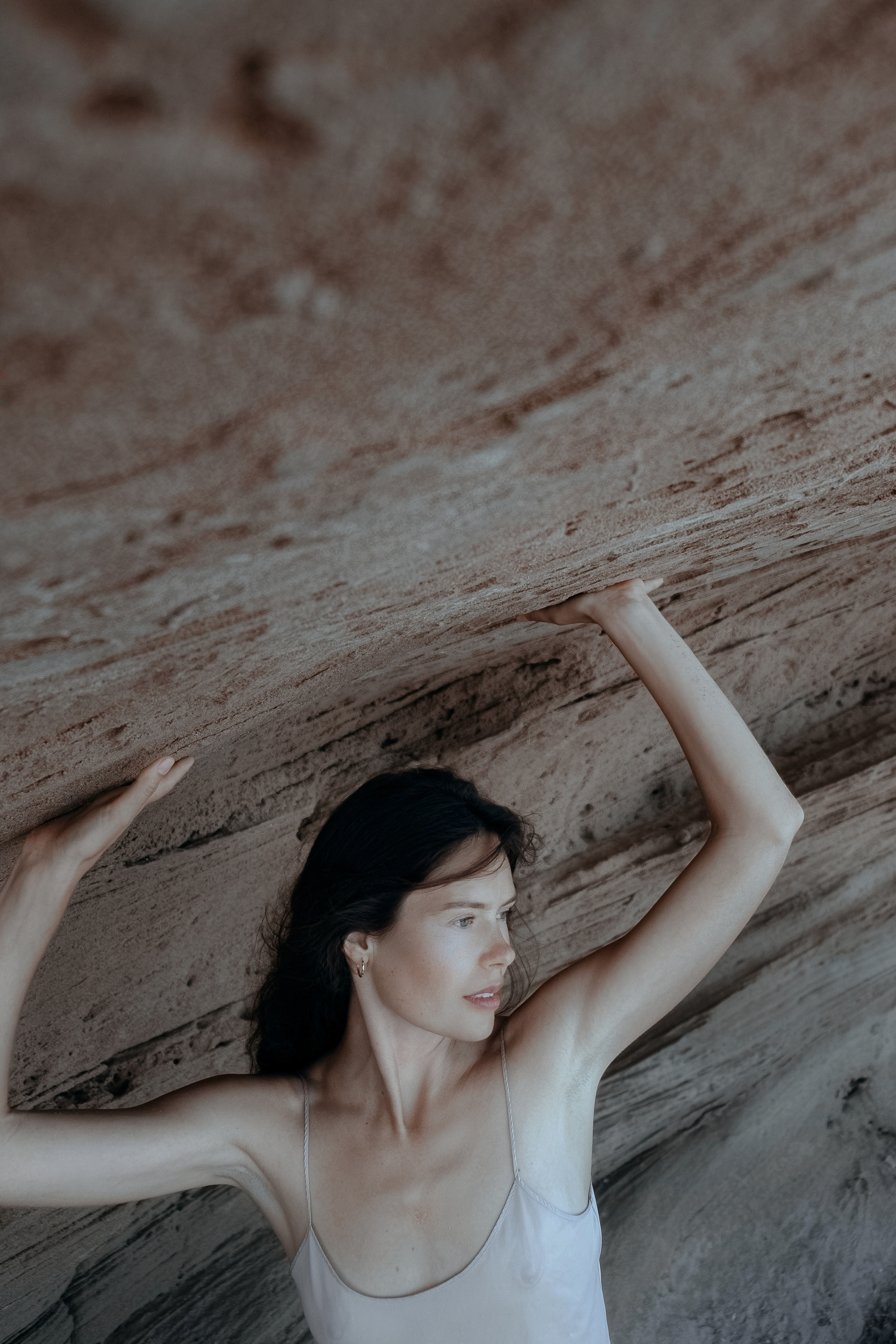 Conceptual photo session on a rocky beach