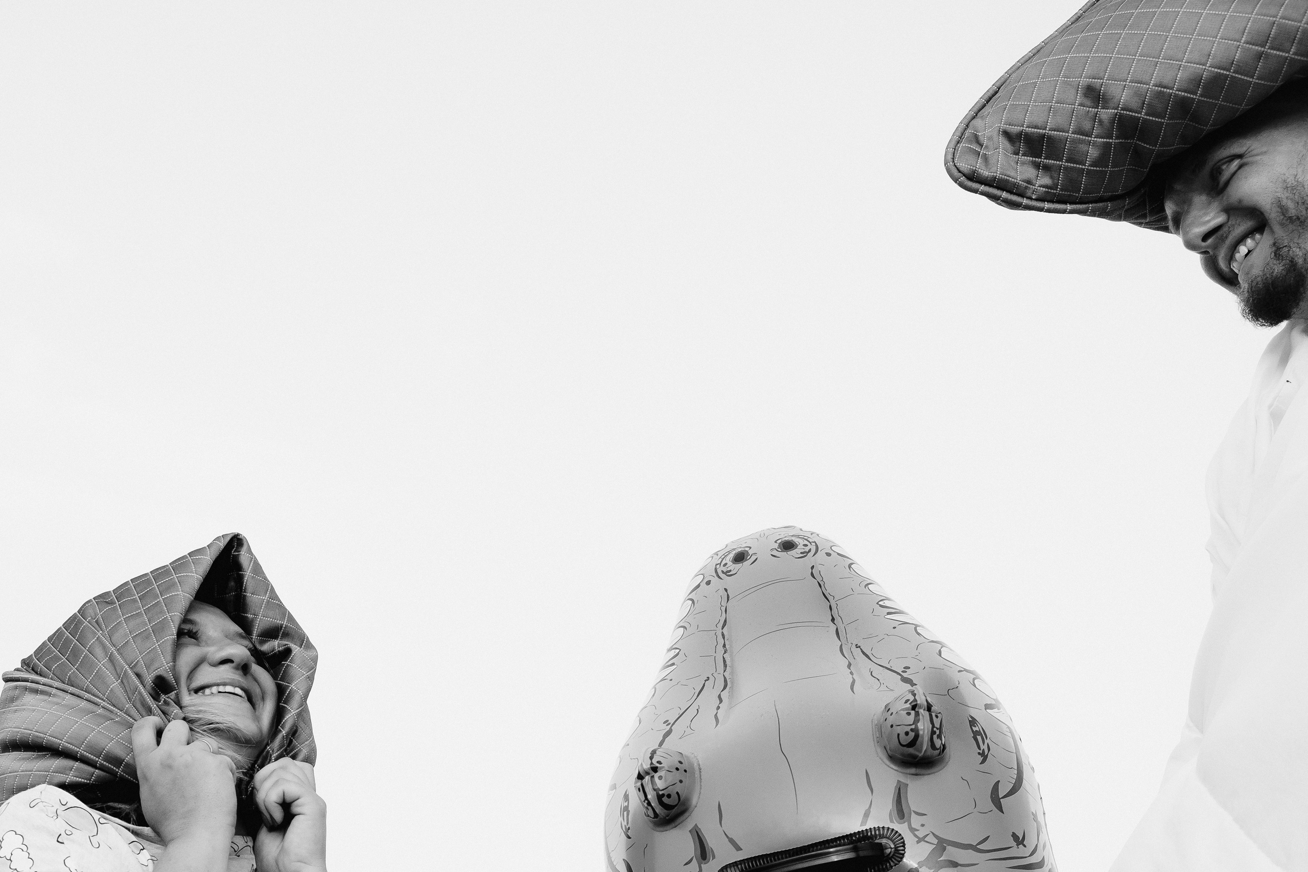 Crazy love story on the beach with an inflatable crocodile