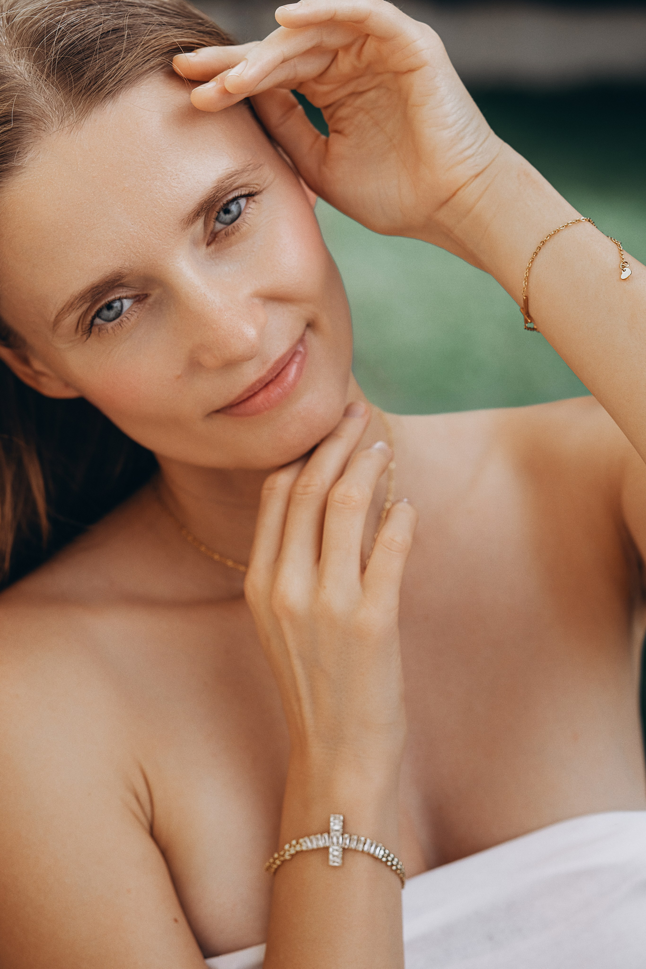 Close-up brand portrait taken in Valencia, Spain showcasing elegant gold and diamond jewelry including a cross bracelet and delicate chain, ideal for luxury product and content photoshoots in Valencia and across Spain — perfect for brands seeking refined and natural visual storytelling.