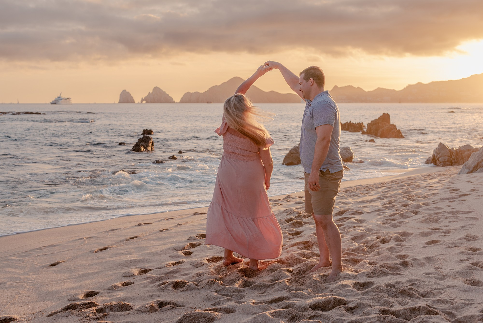 Relaxed family vacation photo session on Playa Monumentos Cabo San Lucas with iconic El Arco rock in the background