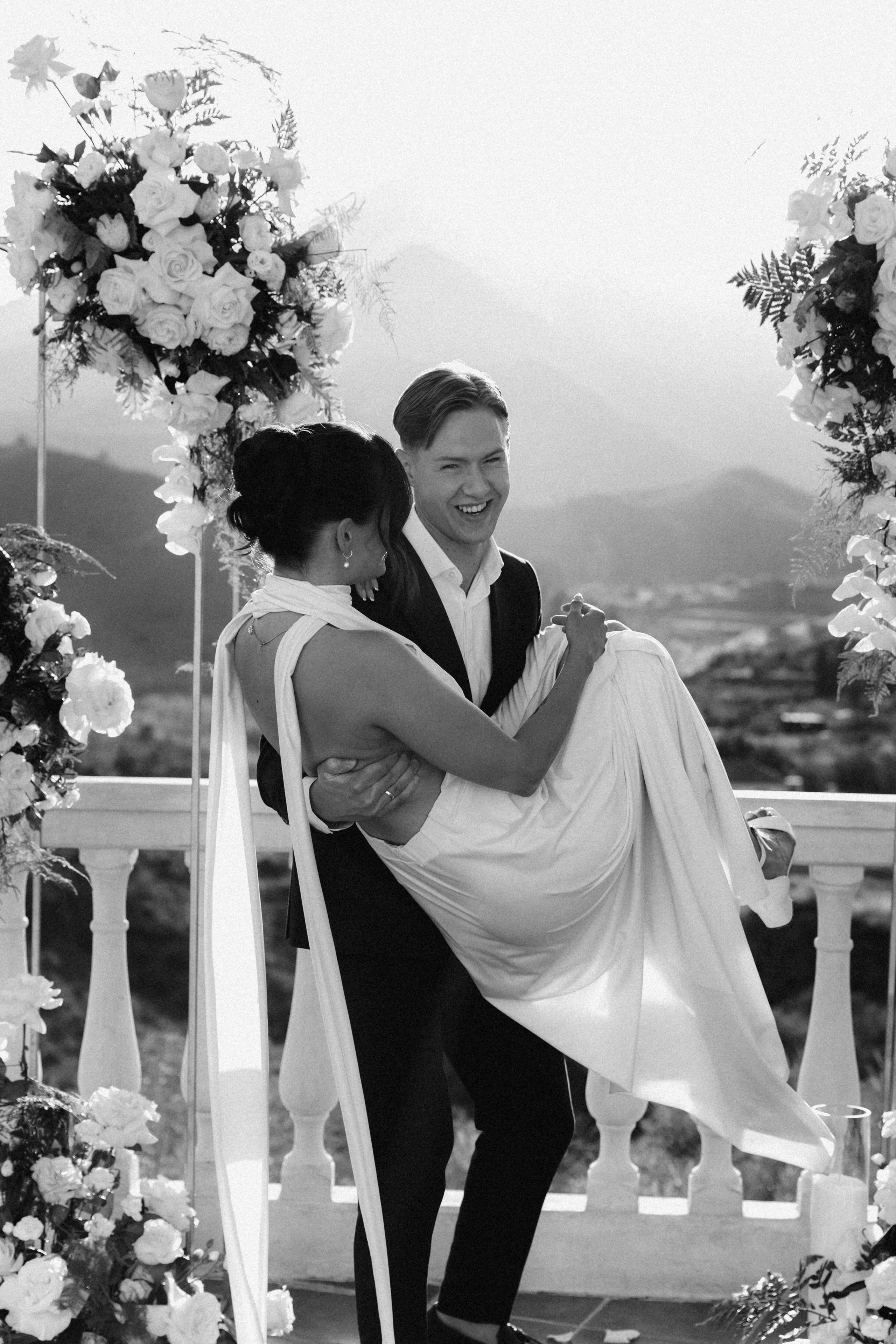 Groom and bride laughing together