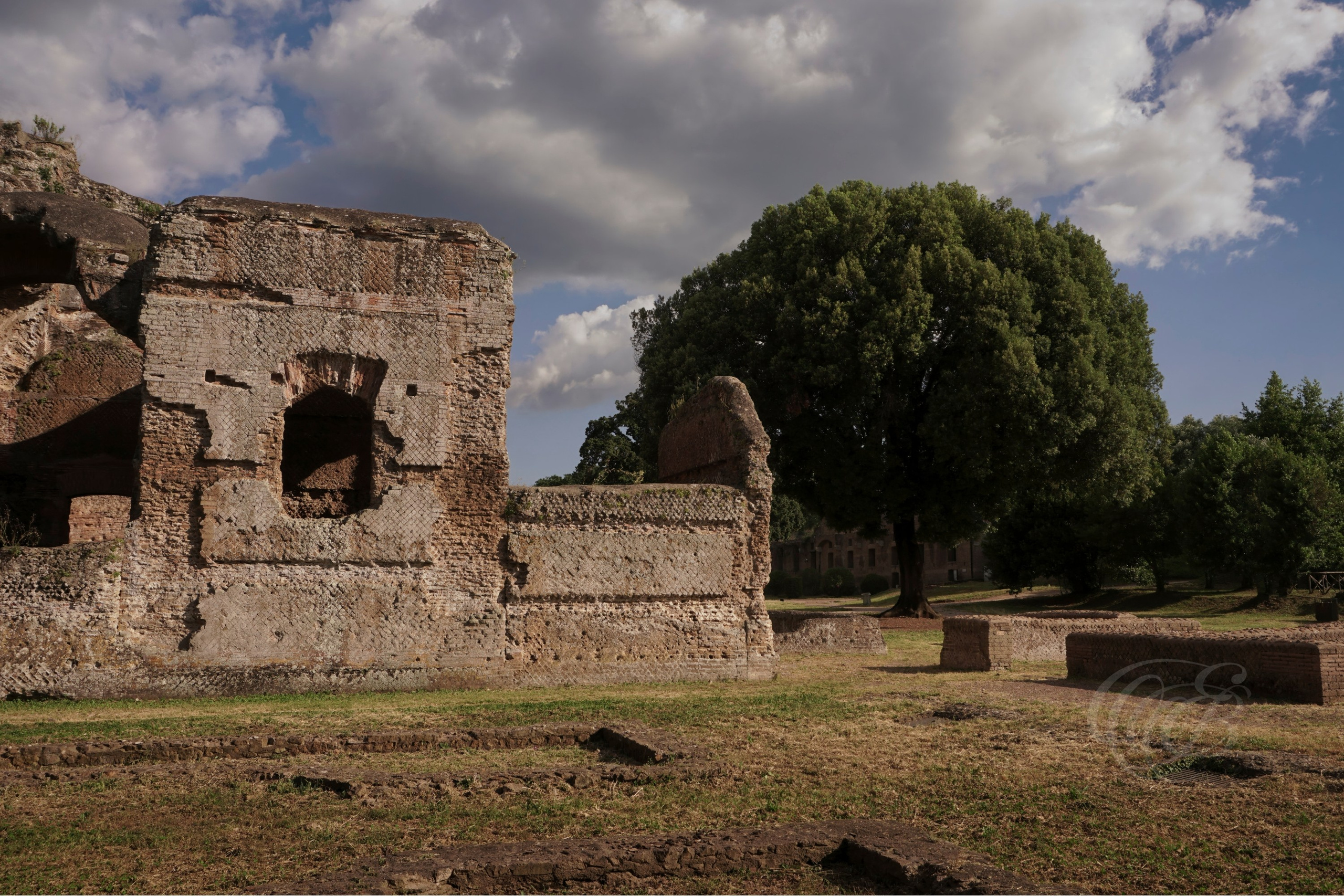 The warm light of sunset enhances the textures and colours of the Great Thermae, revealing the character of the ancient brickwork and creating a peaceful atmosphere as the day draws to a close at Hadrian's Villa.