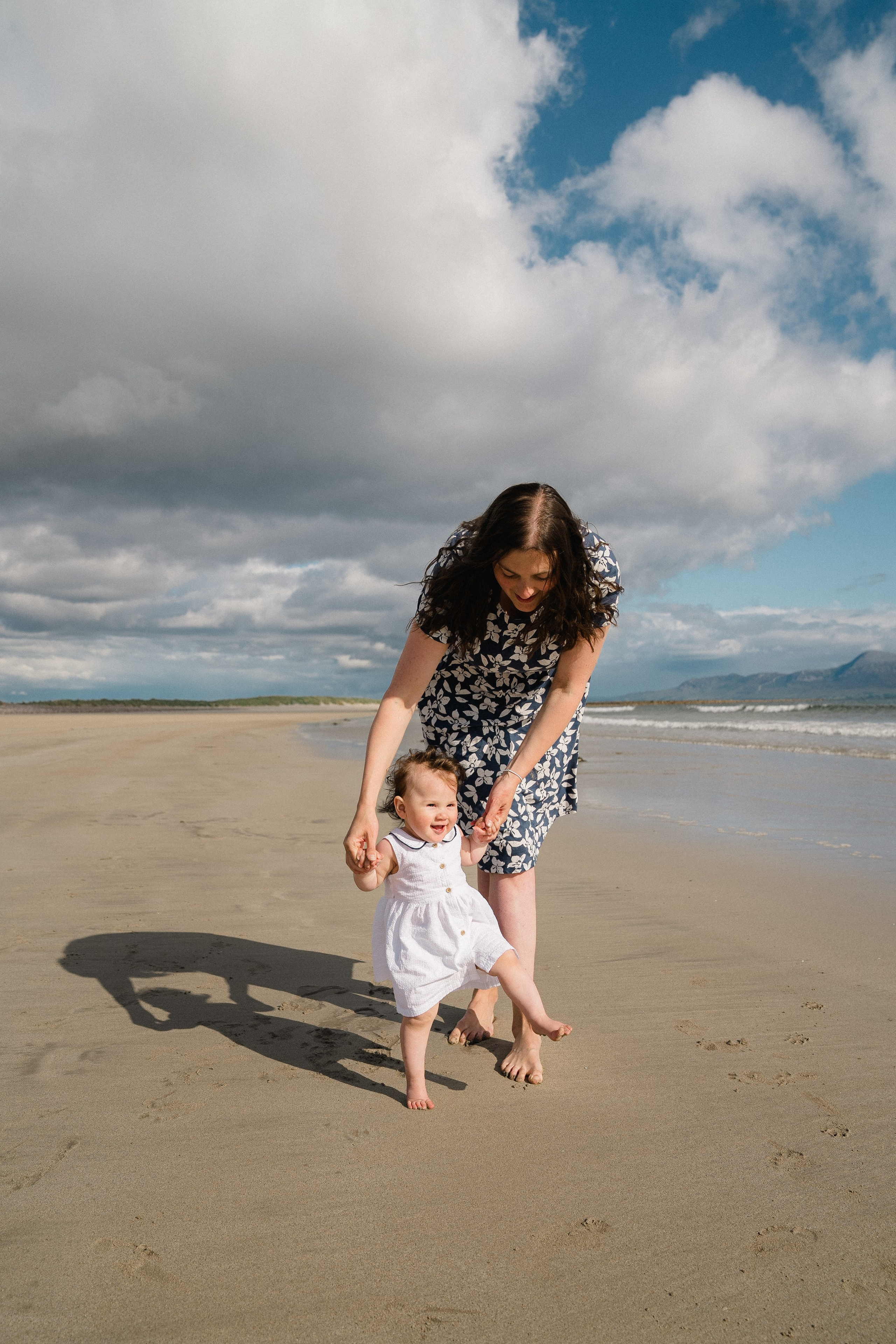 Darya and Mia at the ocean. Wedding and family photographer Ireland