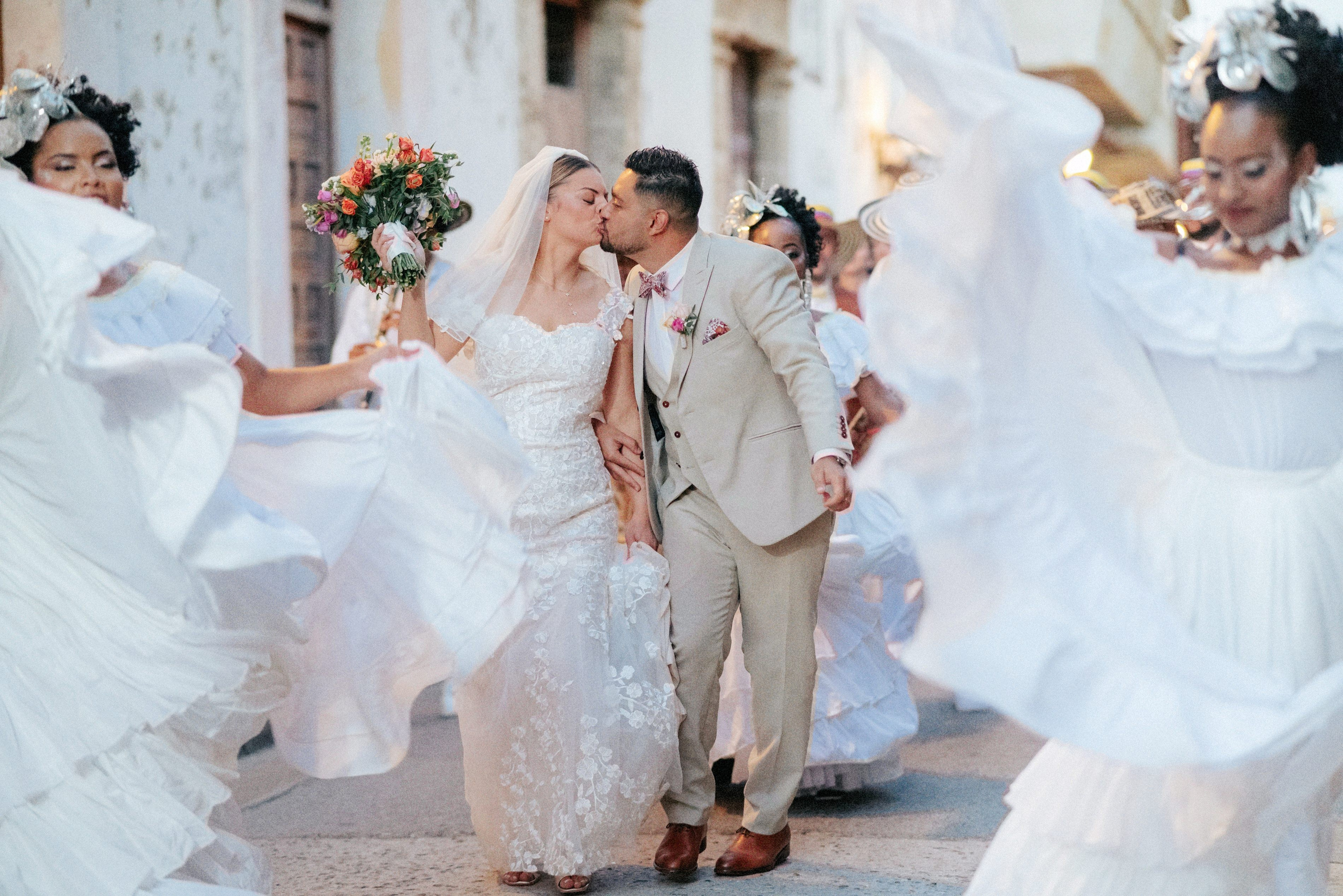 Wedding celebration with guests dancing in Cartagena, joyful destination wedding moments
