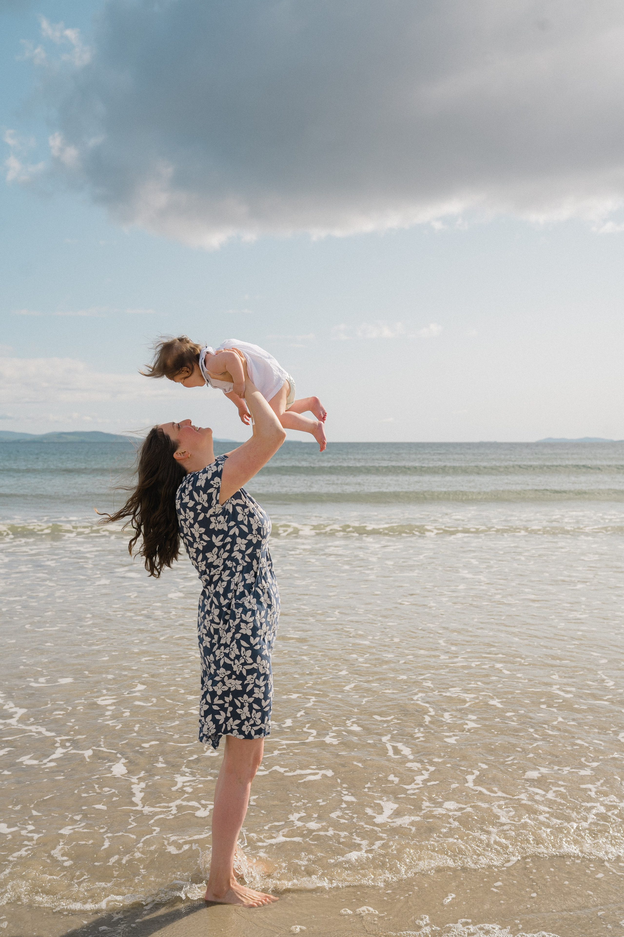 Darya and Mia at the ocean. Wedding and family photographer Ireland