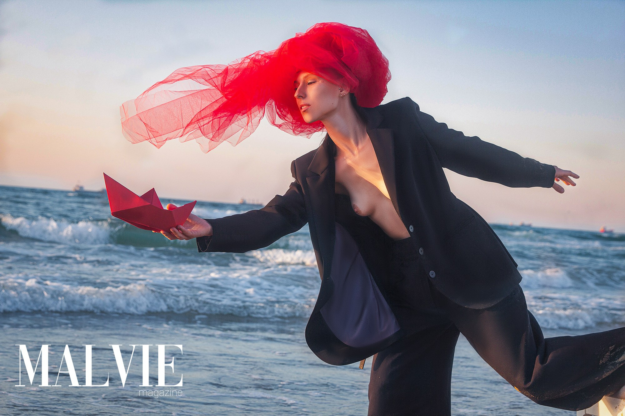 fashion photoshoot in Istanbul with red accents by the sea