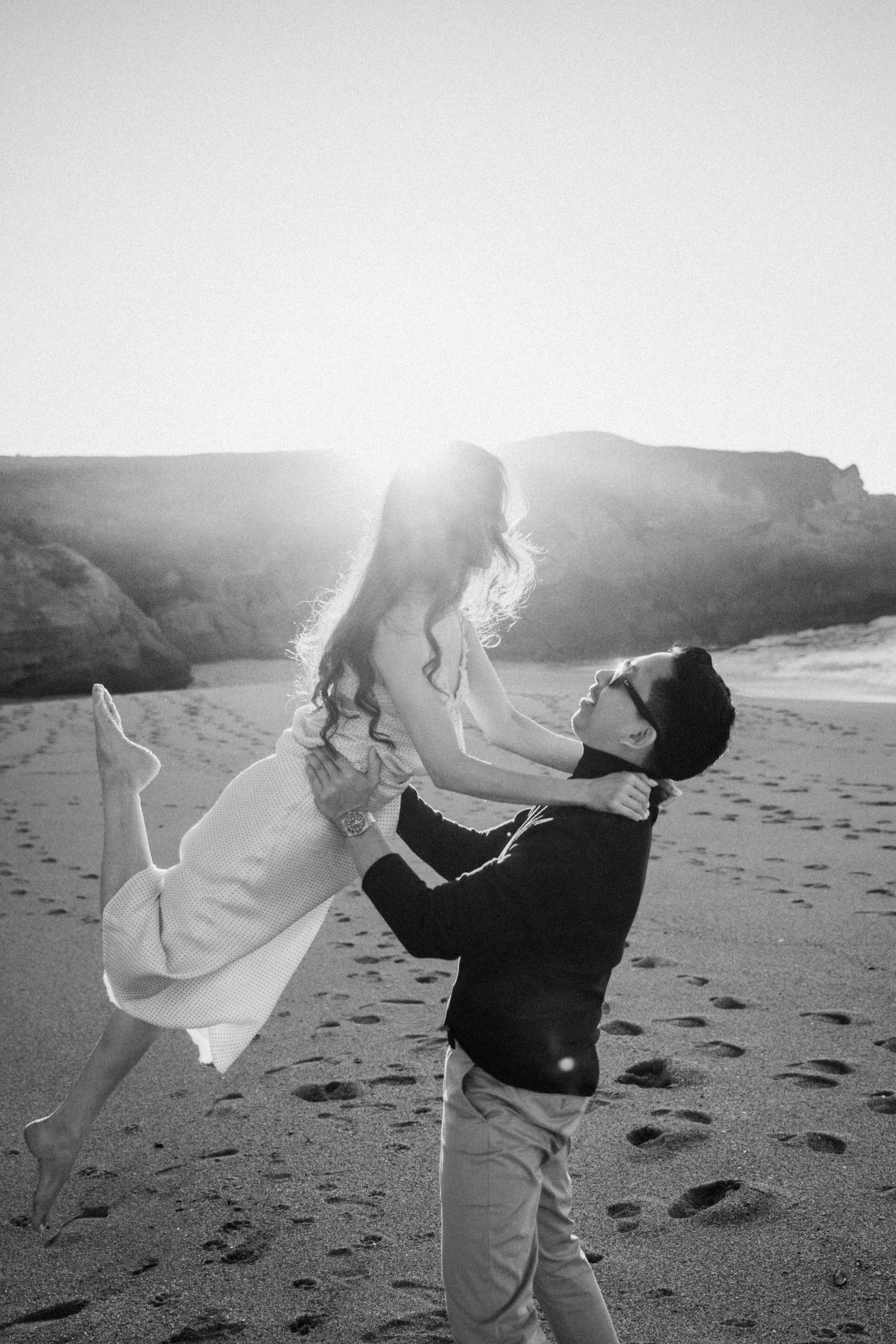 A photo shoot on the San Francisco beach at sunset. Engagement session. 