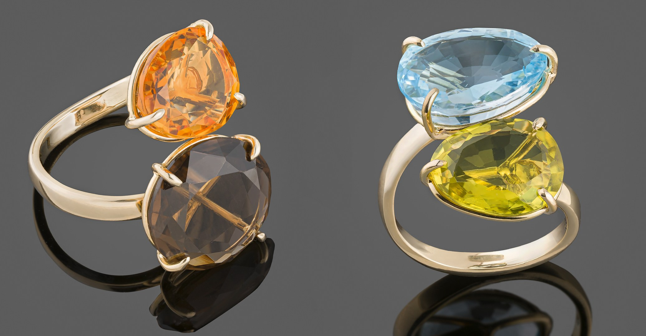 Dva zlatna prstena sa dragim kamenjem.