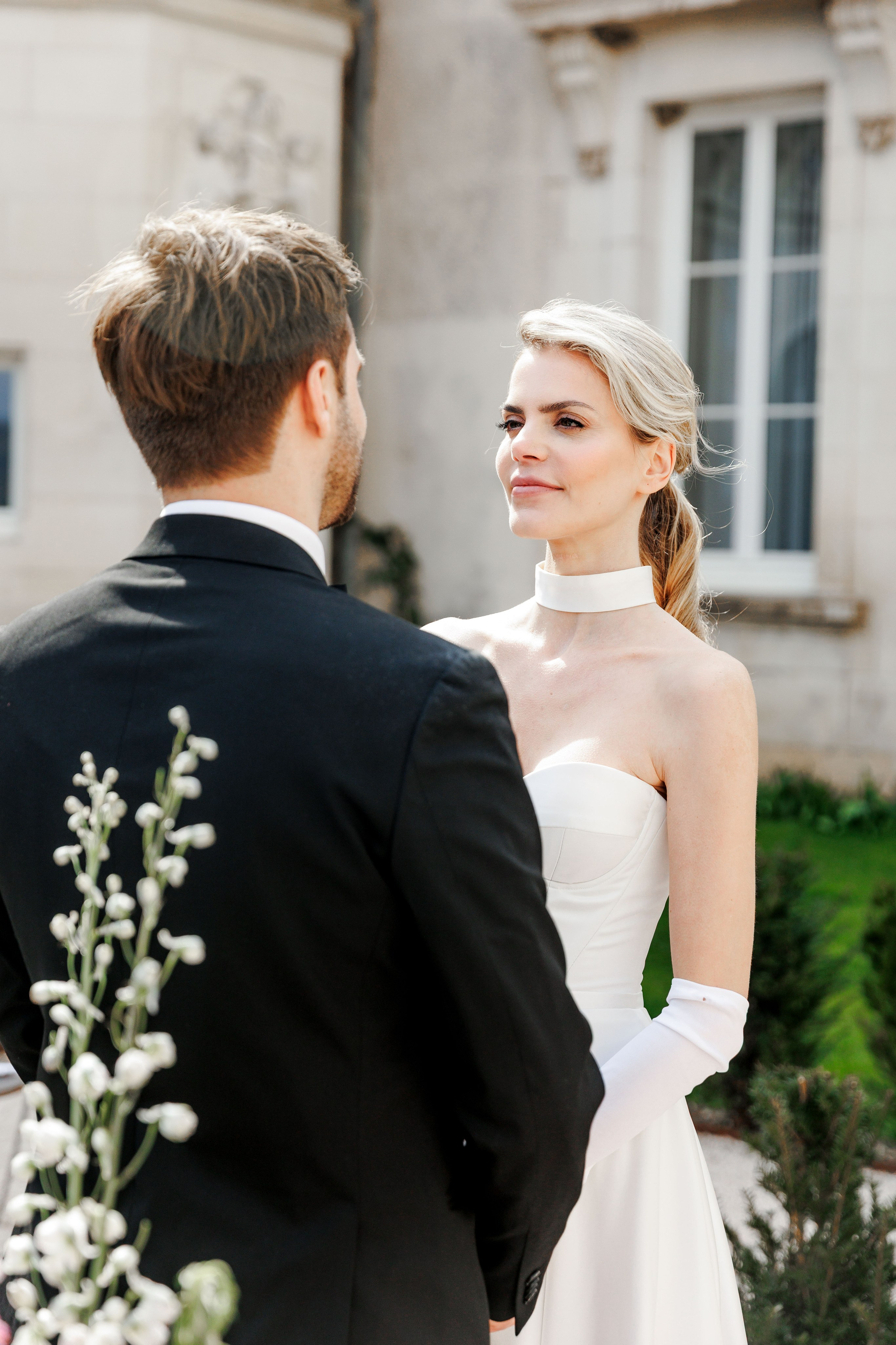 Intimate moment of the bride and groom sharing their love during their wedding ceremony in France. 