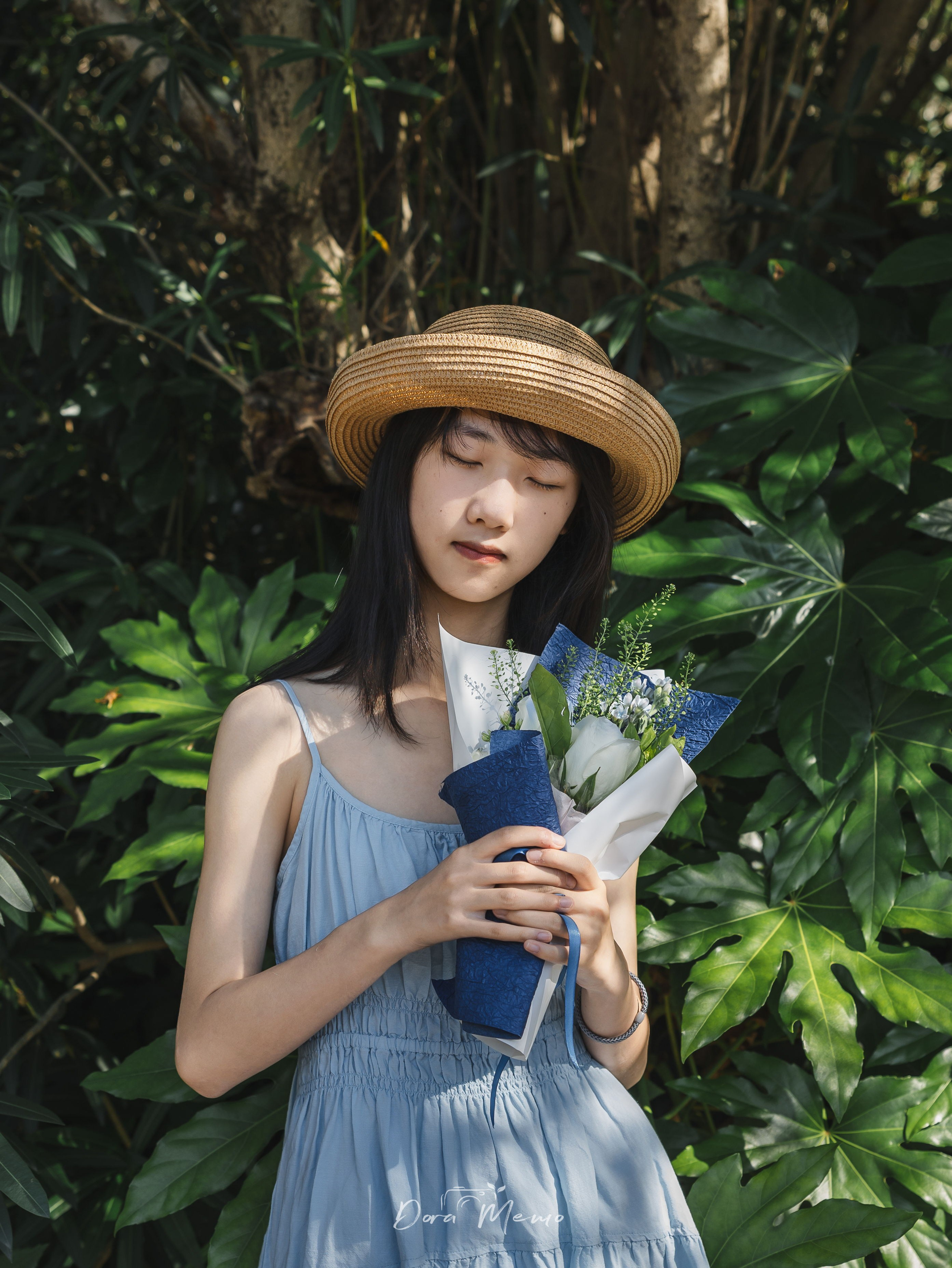Eyes closed holding a bouquet, intimate close-up to end | A final quiet moment — eyes closed with flowers, soft light fading