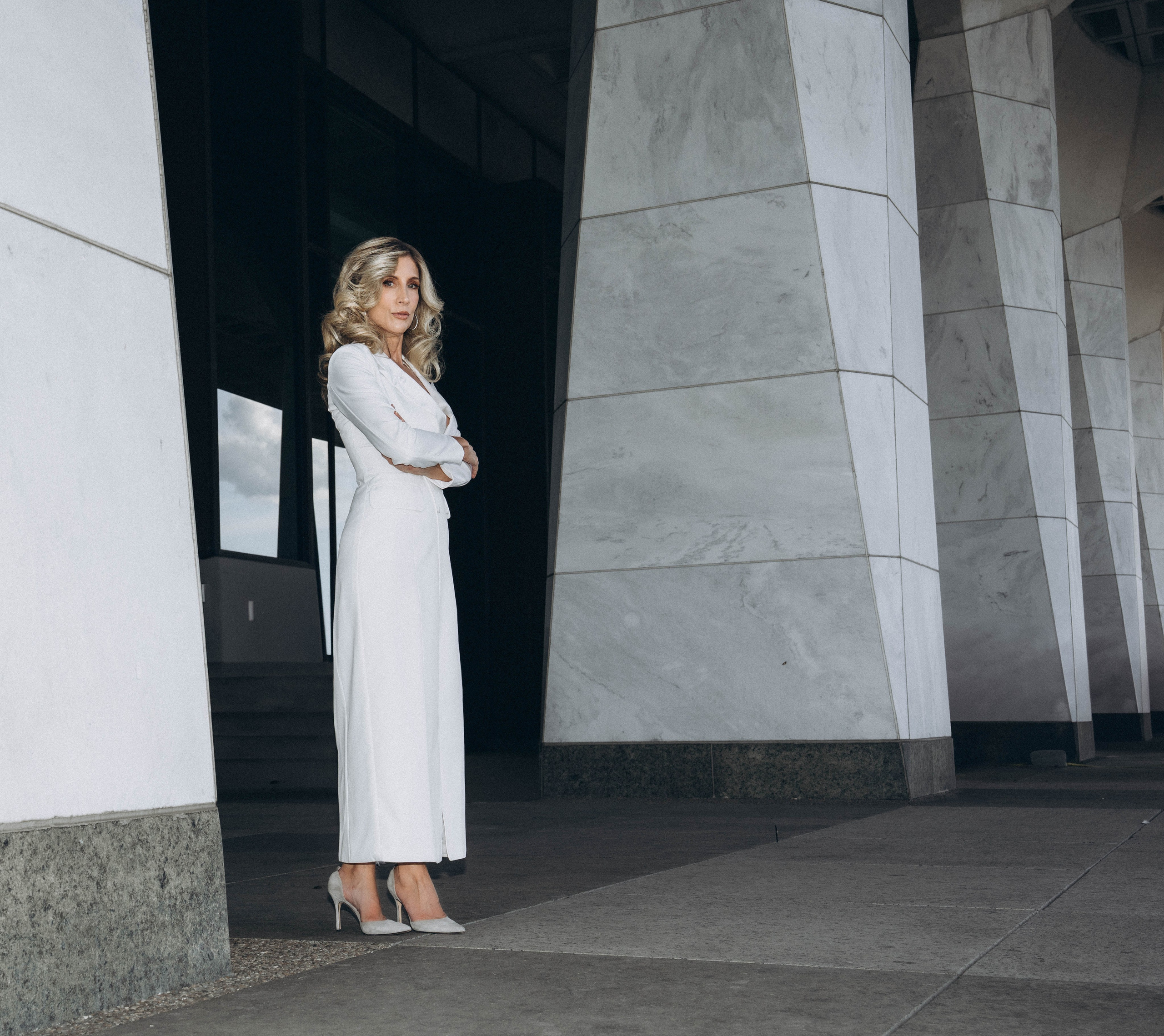 Bride with veil blowing in Catskills mountain breeze.
