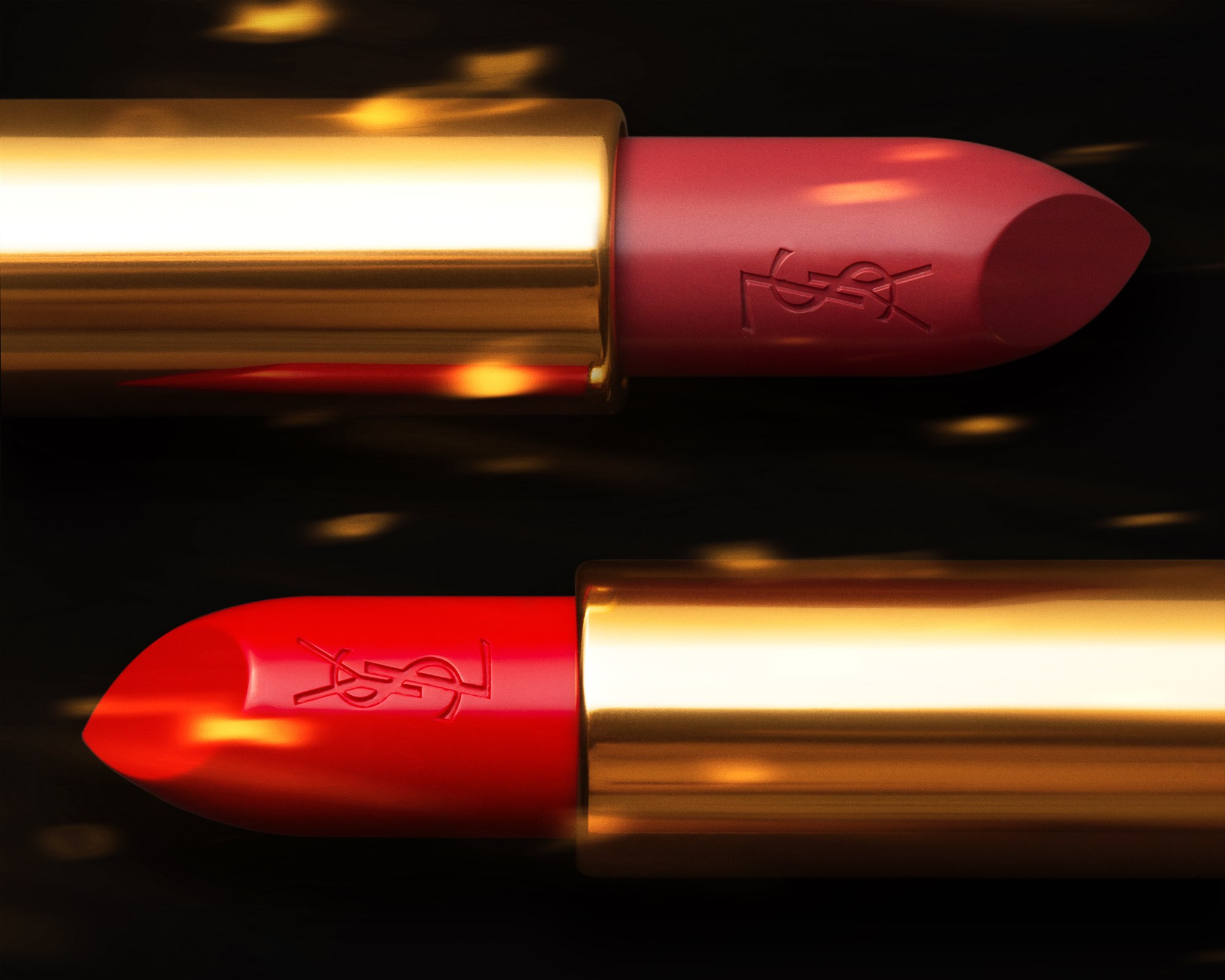 close-up of two YSL lipsticks in red and rose tones with gold cases, showcasing premium quality and vibrant colors against a dark background