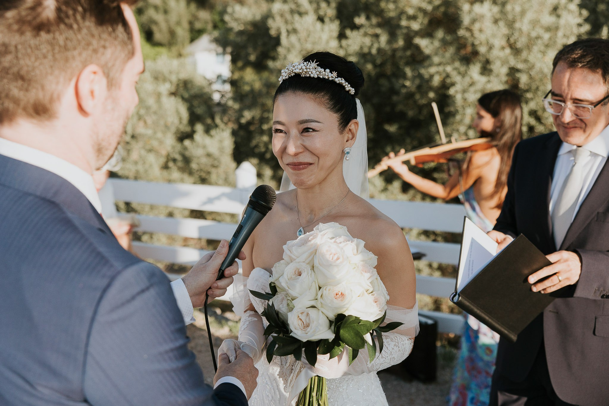 Officiant presenting vows book Son Marroig temple