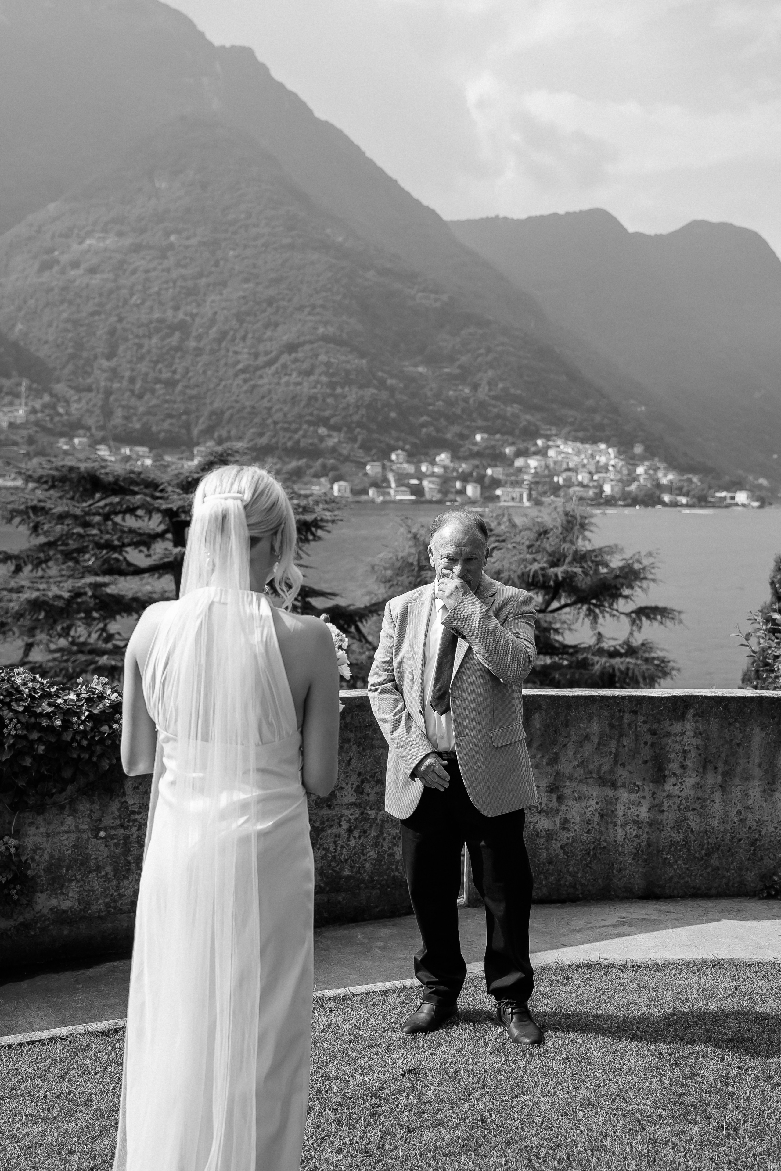 Black and white photo of the couple by Lake Como at Villa Lario, Italy