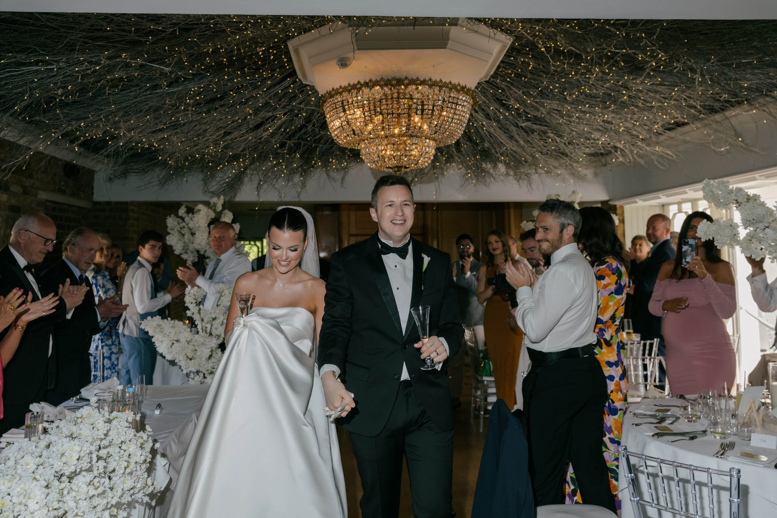 Bride and groom entering reception celebration wedding party moment