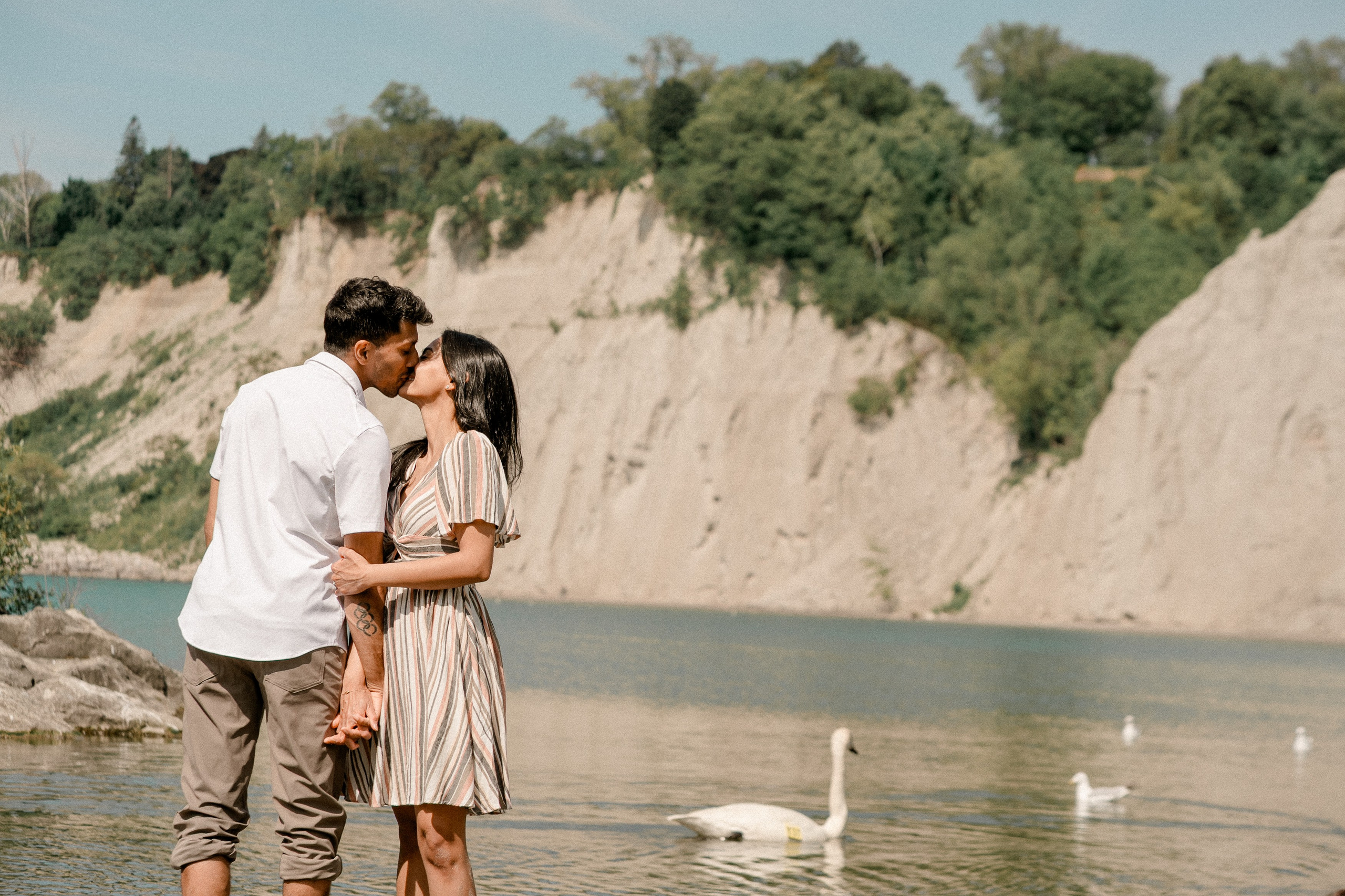 Sunset kiss by the lake — a heartfelt moment before the wedding day