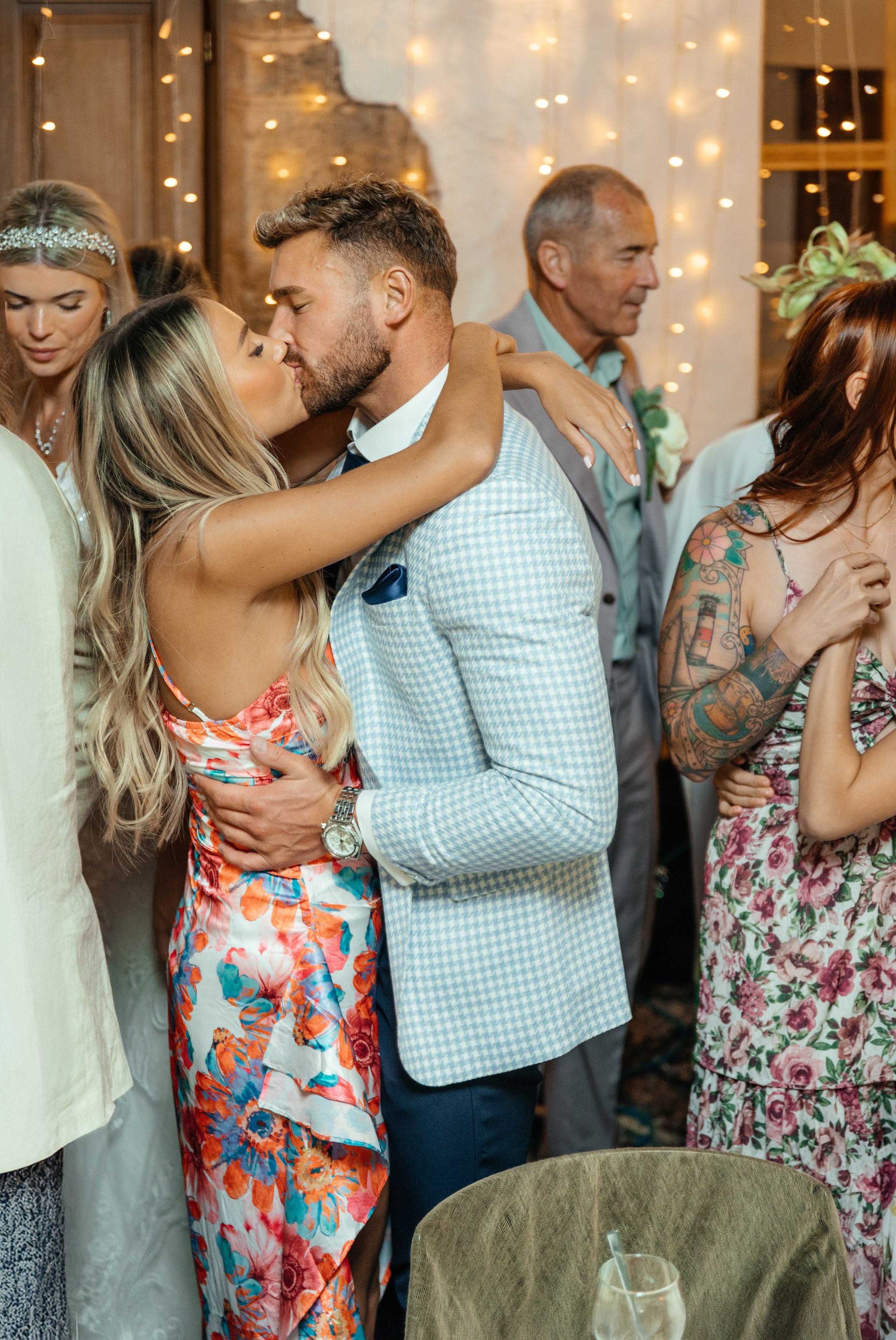 Guests are kissing at the wedding party in a lively Lindos restaurant in Rhodes.