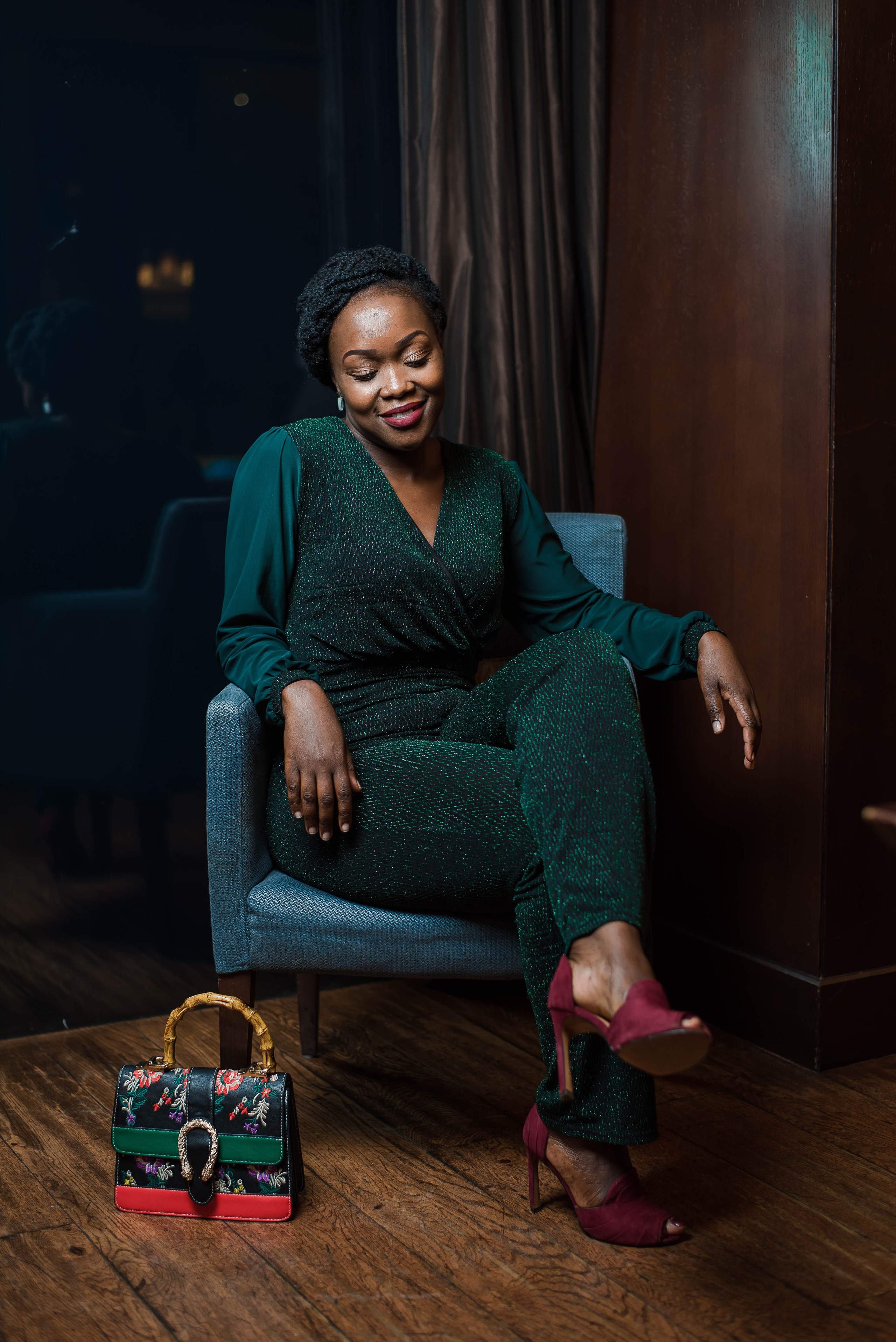 Elegant woman in green suit seated on a chair — studio portrait by Nick Ouma Photography, Nairobi, Kenya