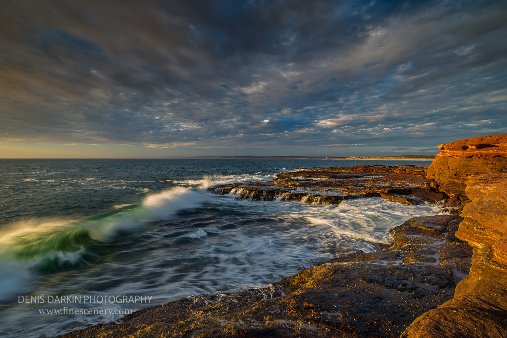 Emerald waves of the Indian ocean breaking at Red Bluff near Kalbarri, Western Australia. Red bluff beach, ocean, sunset, after storm, surge