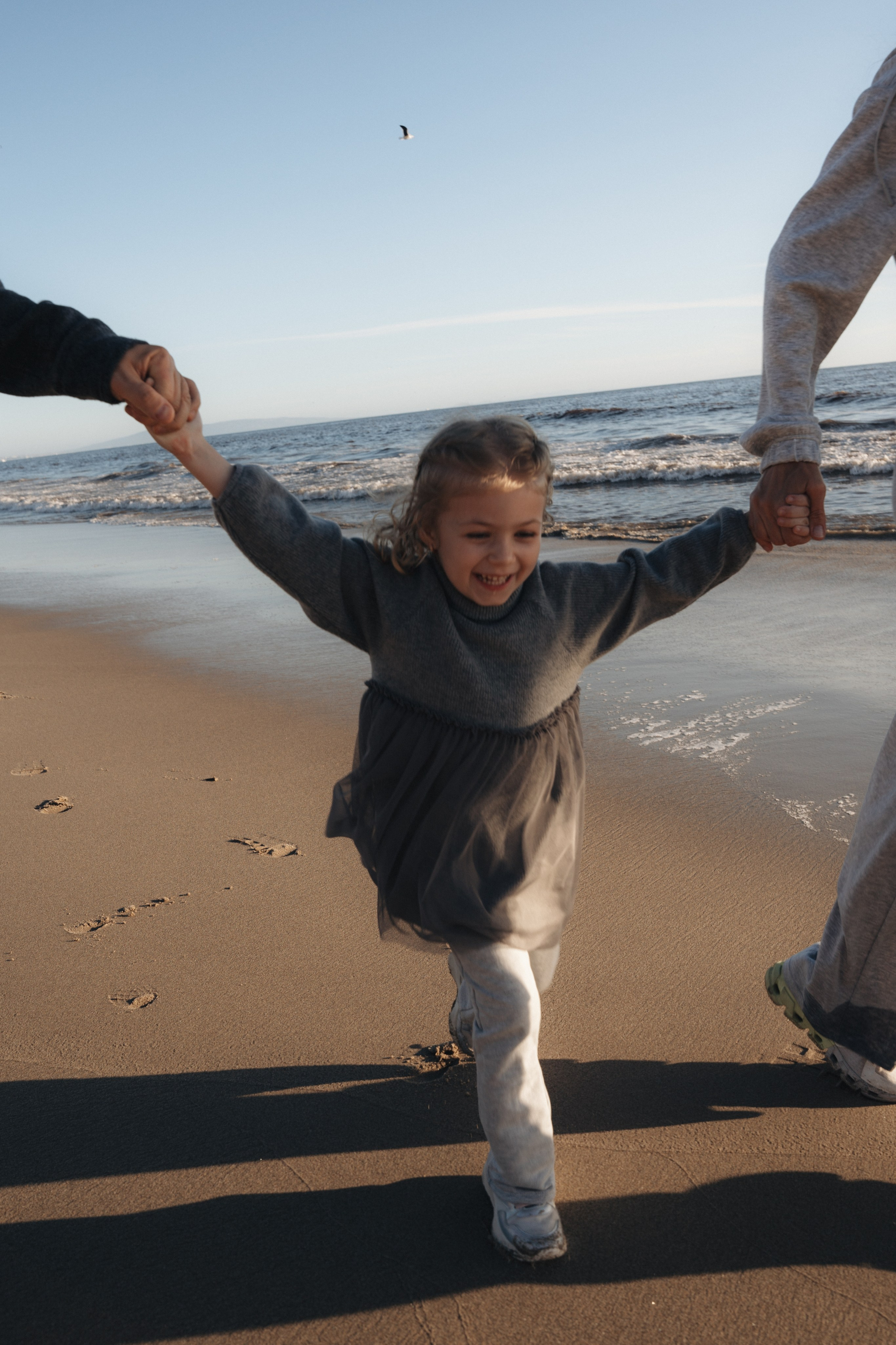 Family photoshoot. Family photoshoot outside. Beach photoshoot. Family holiday photoshoot. Sunset photoshoot