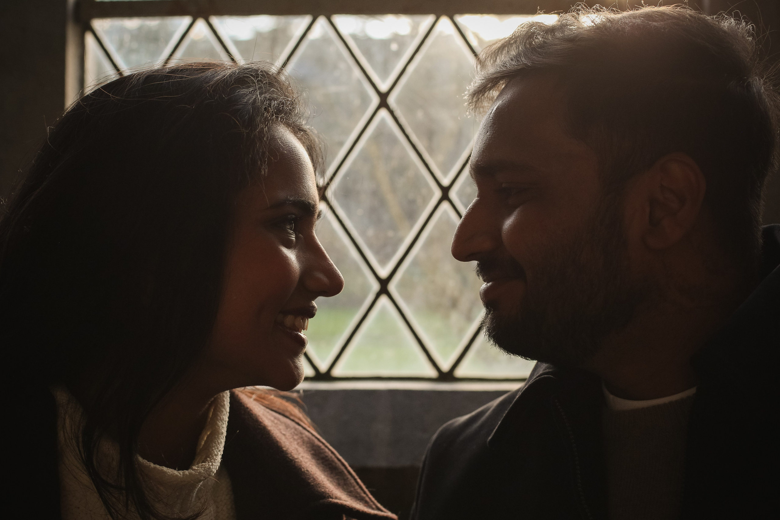 A quiet, cinematic close-up where light and expression draw attention to emotion, connection, and shared presence.