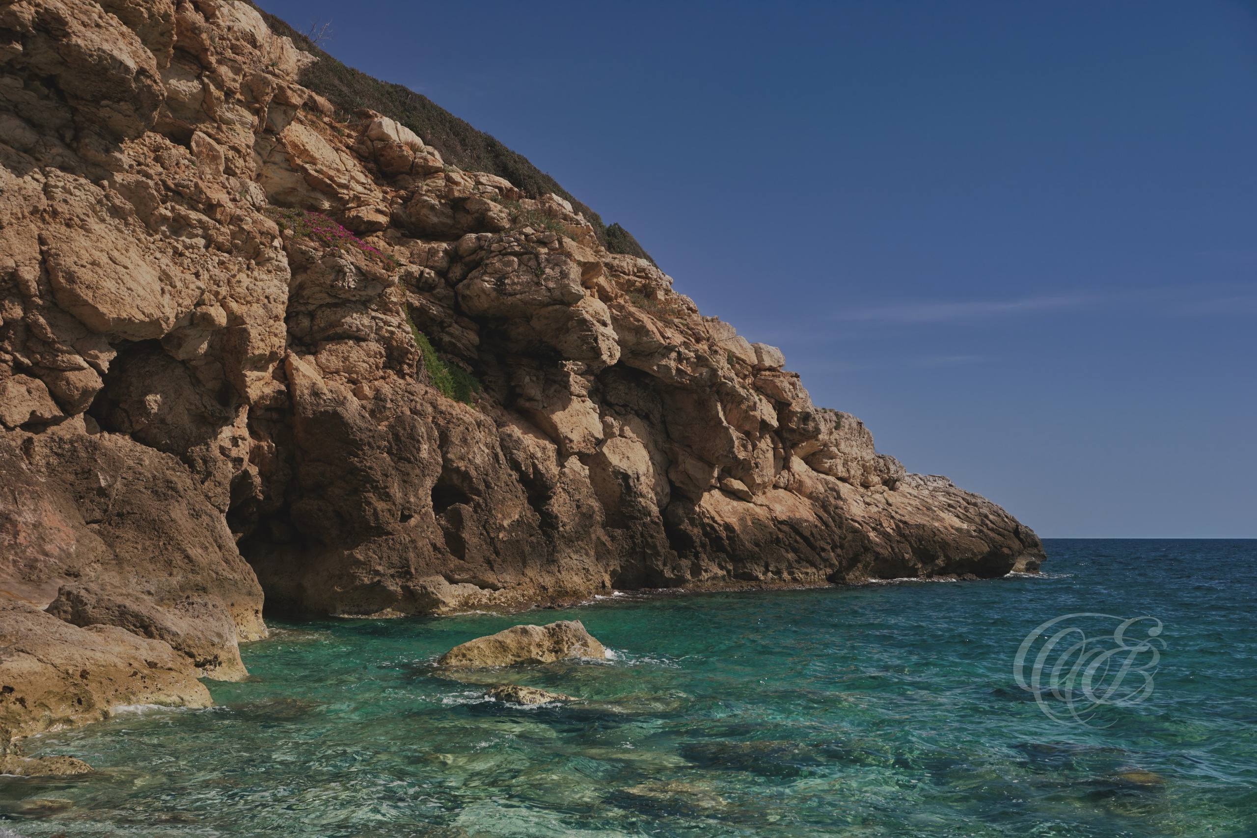 Punta des Grells offers open views across the Mediterranean coastline near Palma, where rocky shores and expansive sea horizons shape the natural character of the area. Positioned along one of the quieter coastal sections of Mallorca, the landscape reflects the island’s connection to the sea and the broader scenery of the Balearic Islands. This view captures the openness and coastal atmosphere of Punta des Grells overlooking the Mediterranean. Eduardo Bartoli Photography.