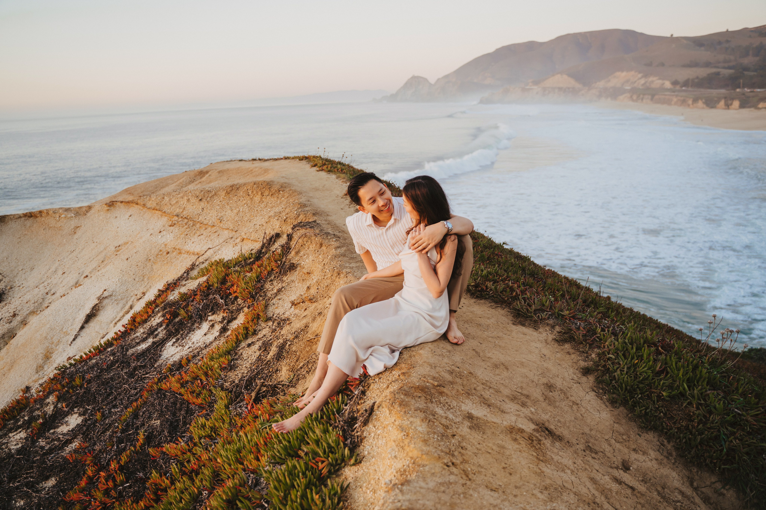A photo shoot on the San Francisco beach at sunset. Engagement session. 
