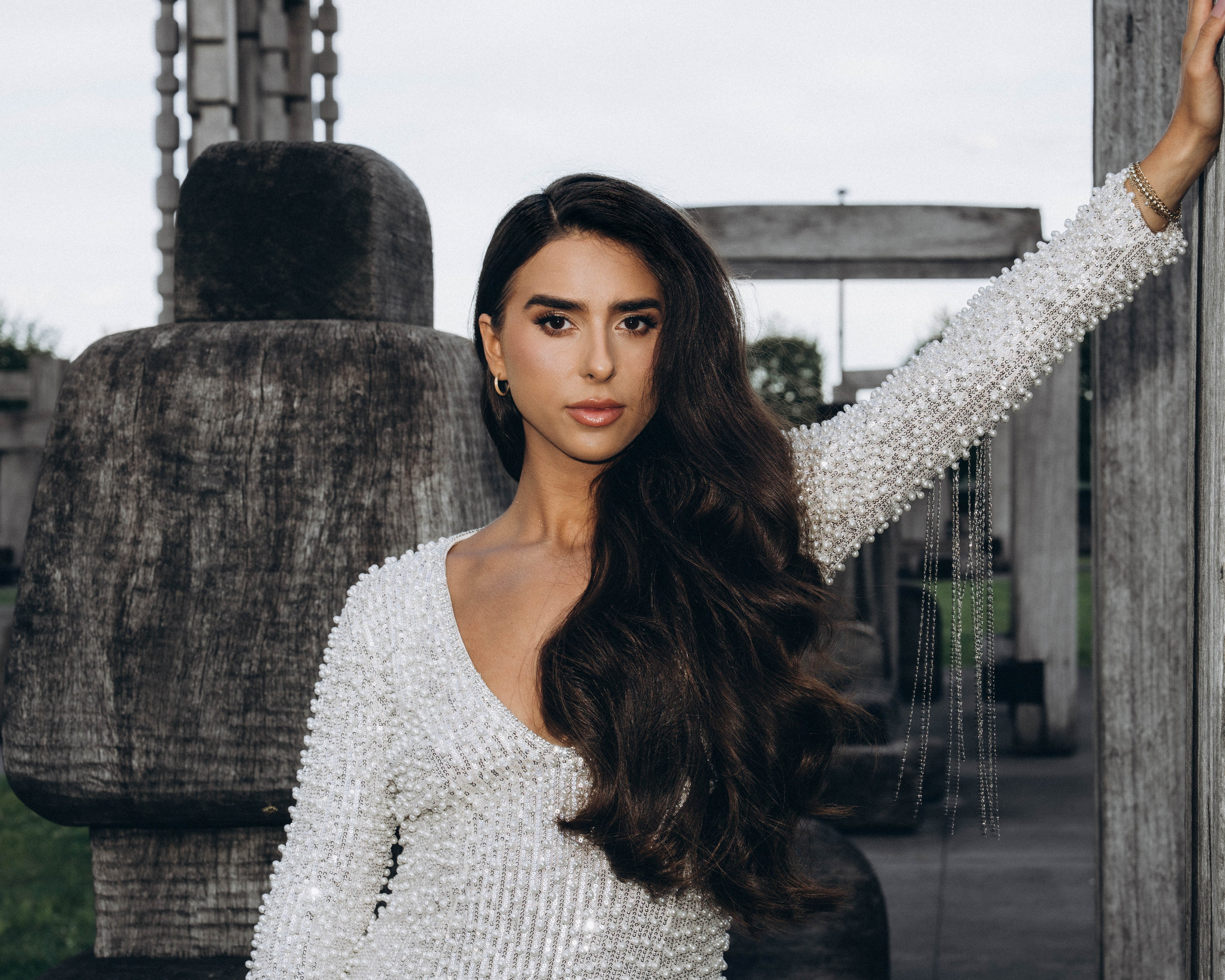 Bride posing in Amsterdam historic town square.