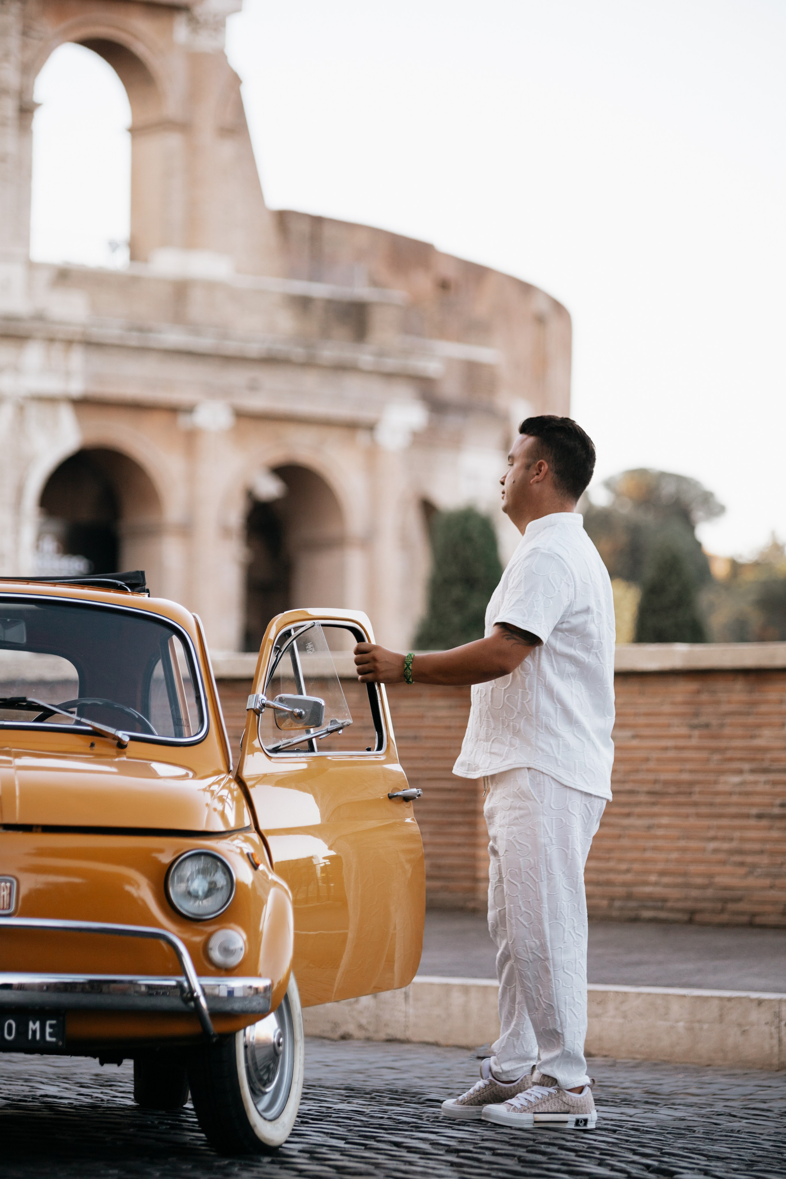 Fiat 500 and Vespa. Photographer in Rome