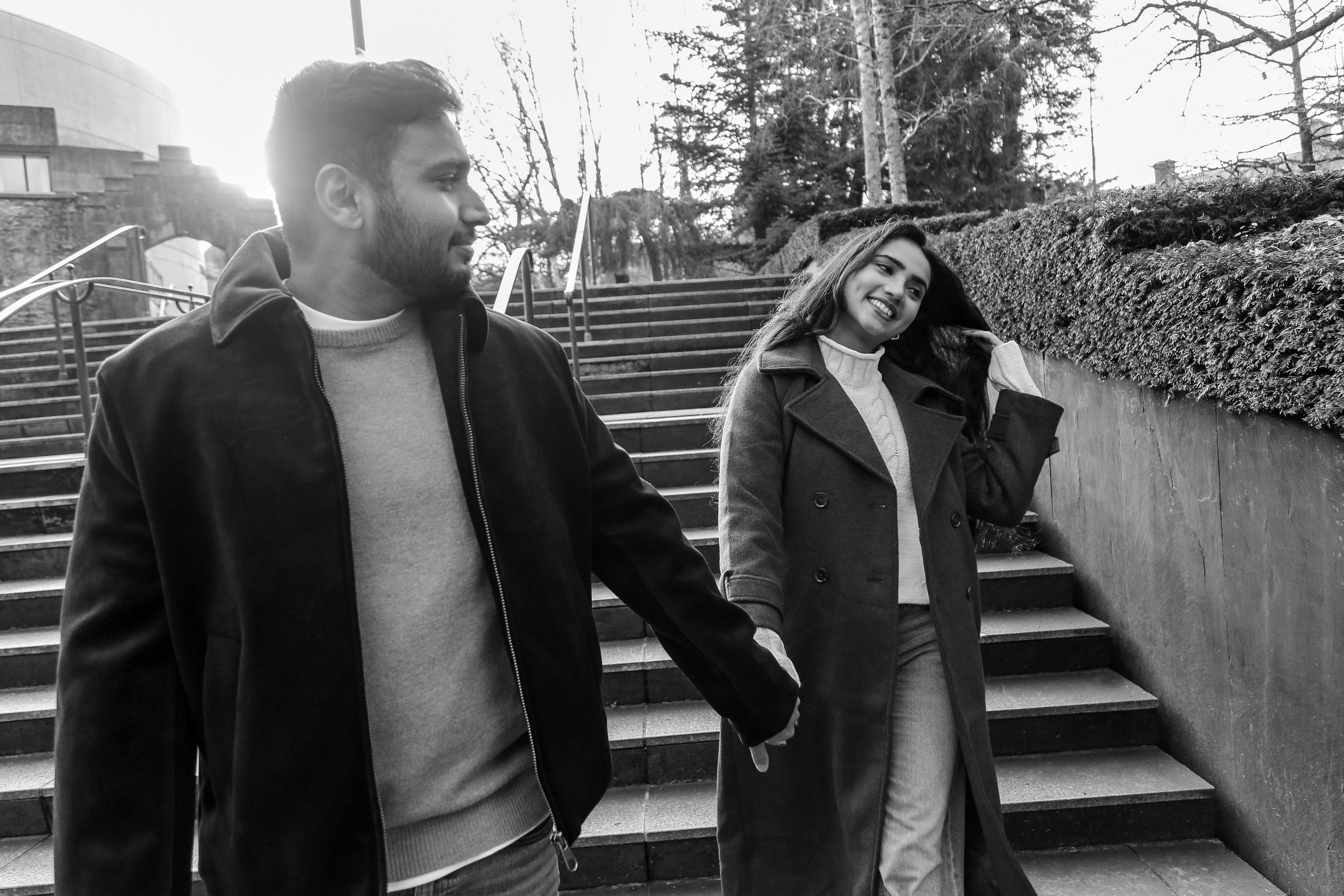 A candid moment in motion, captured in black and white, where expression and connection take precedence over place.