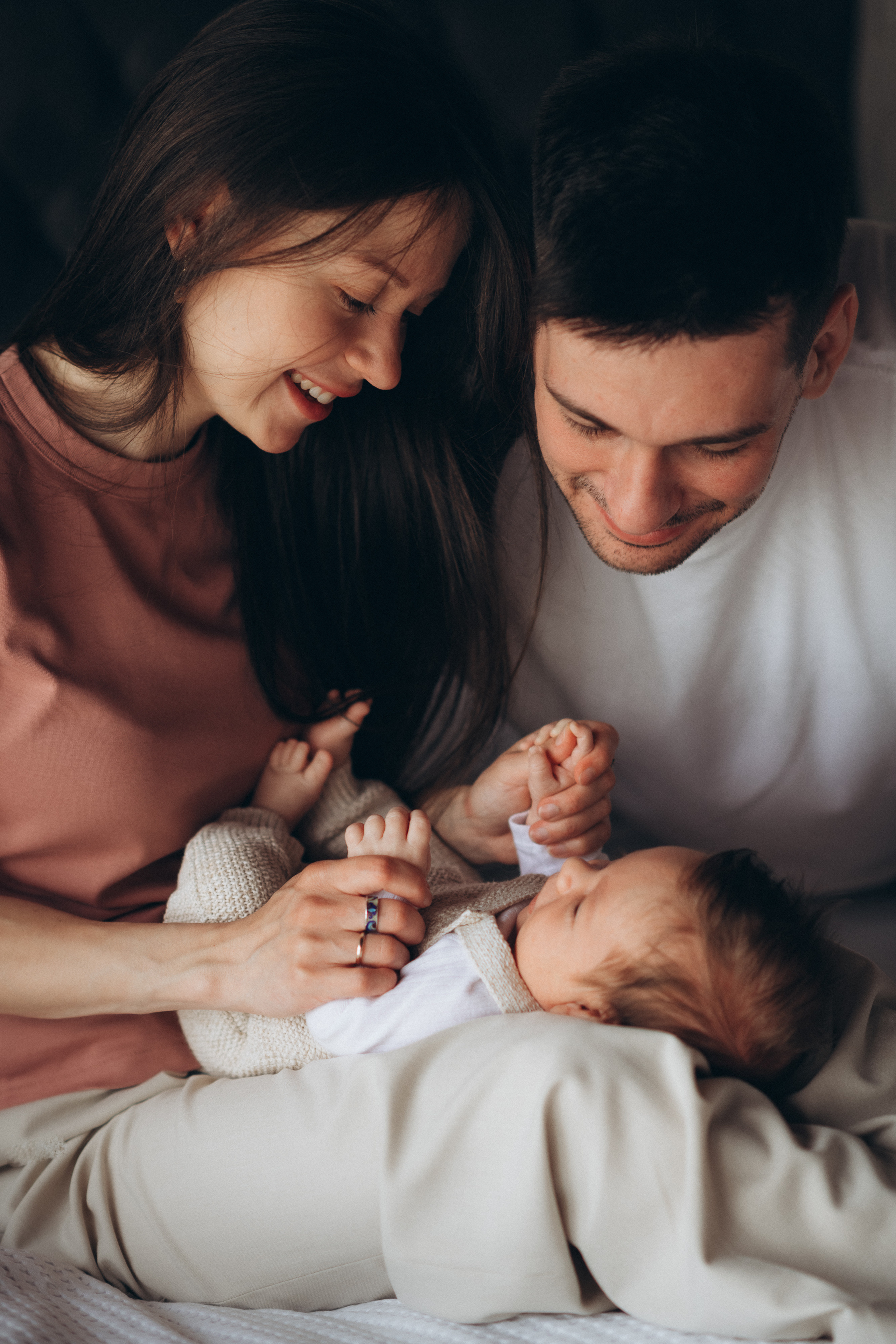 parents look at their newborn baby boy