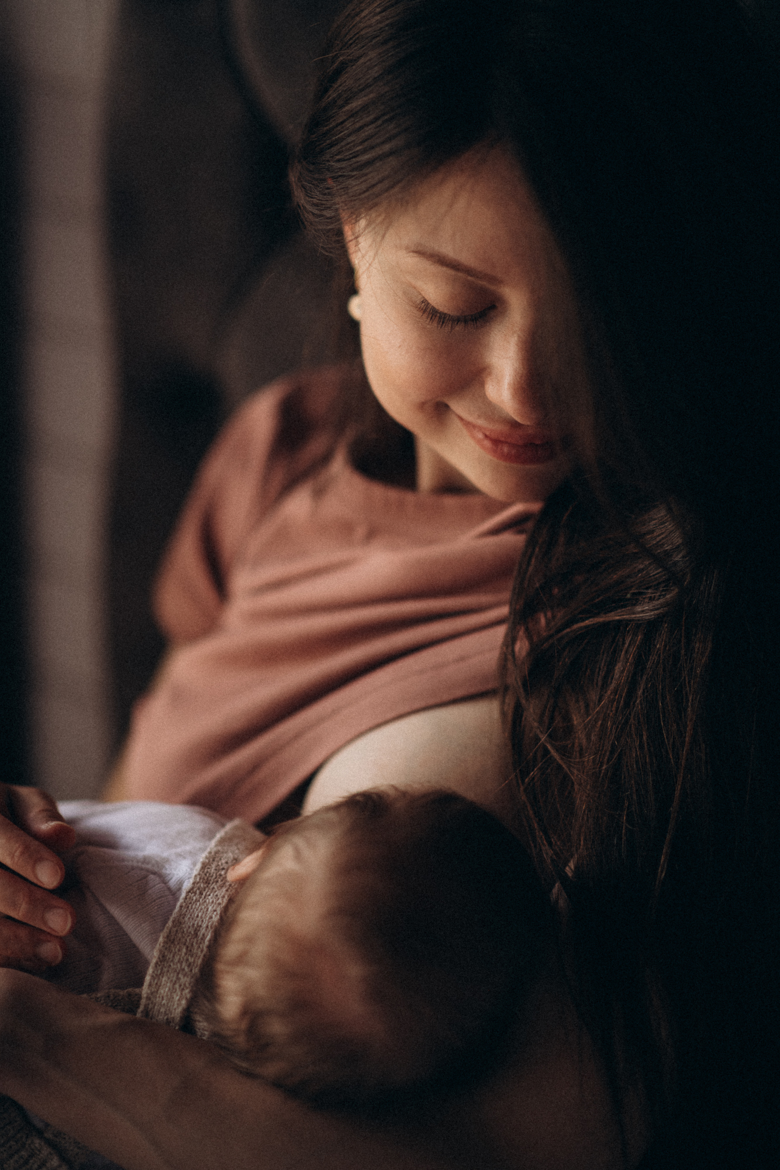 mother feeding her newborn baby