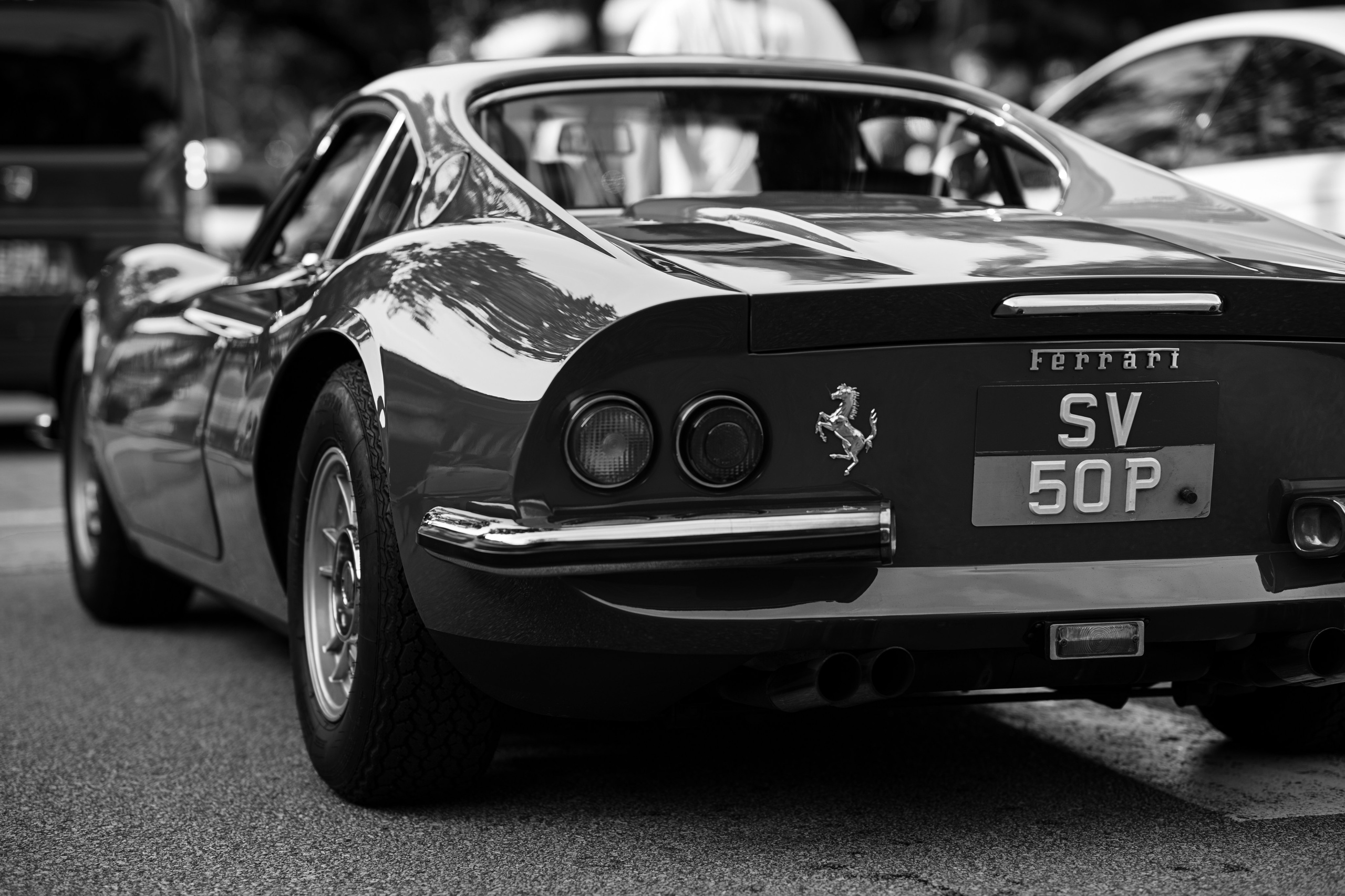 Ferrari Dino rear three-quarter – timeless black-and-white portrait of a vintage Ferrari Dino 246 GT at Cars ’N Kopi meet-up, ideal example of premium classic-car photography available for brand and event coverage.